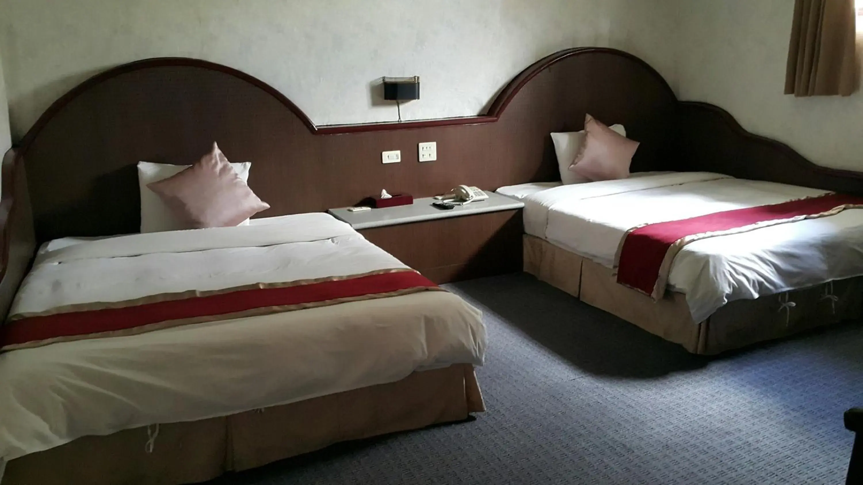 Bed in Mei-Hua Hotel