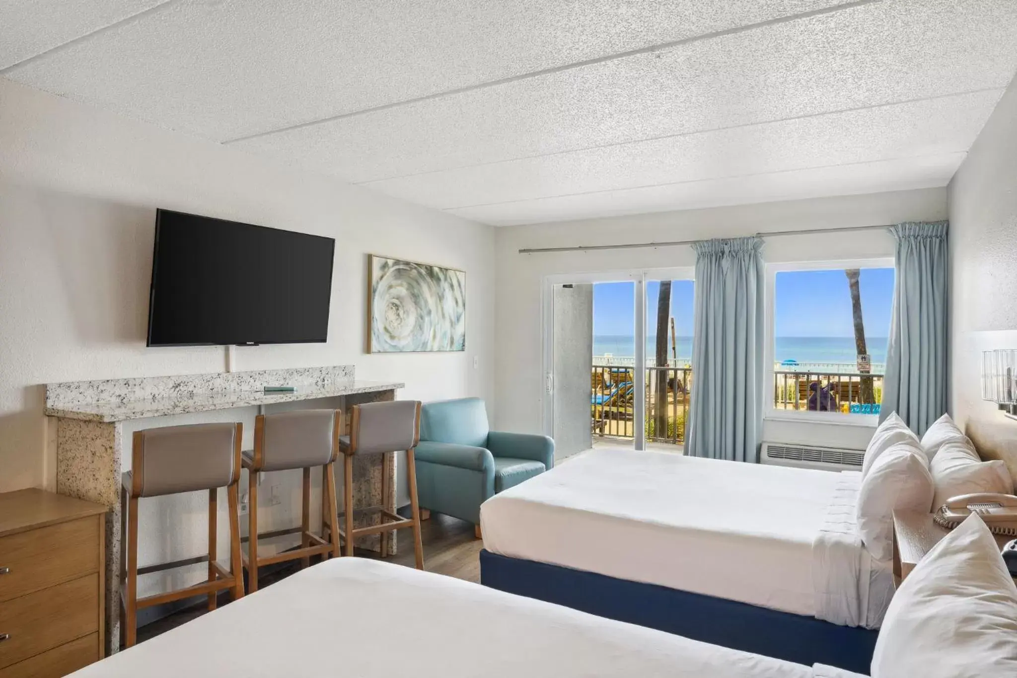 Bedroom, TV/Entertainment Center in Sugar Sands Beachfront Hotel, a By The Sea Resort