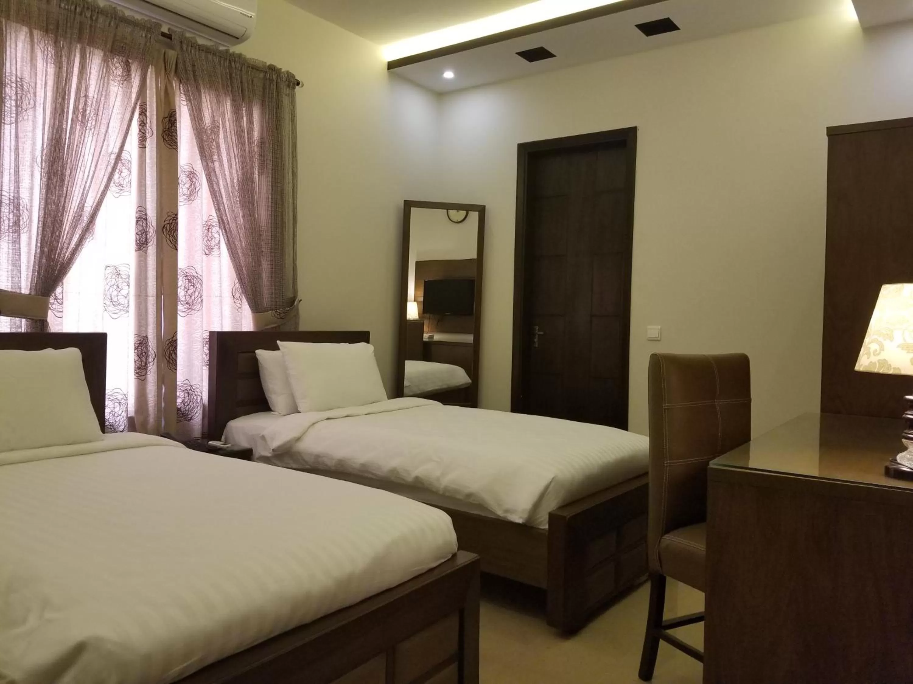 Bed in Zifan Hotel & Suites