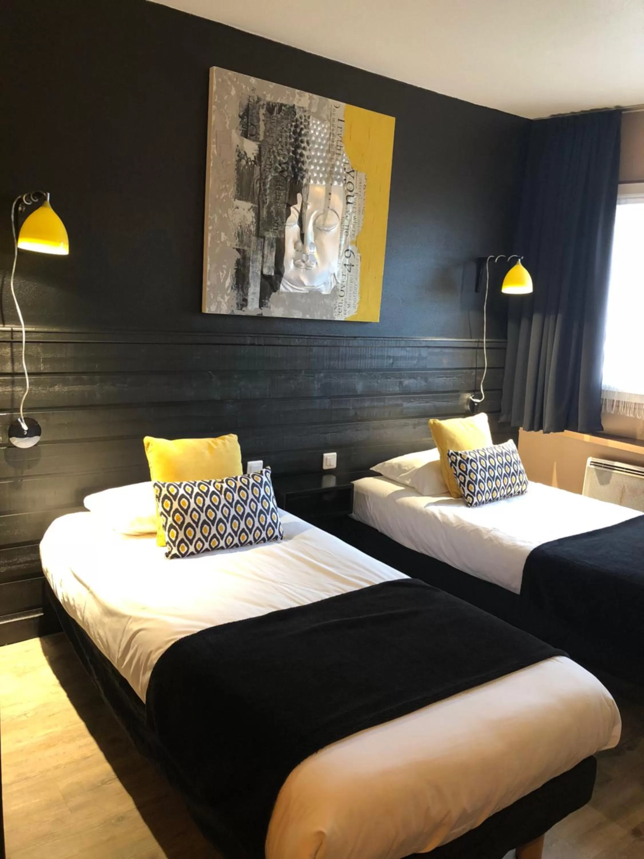 Bed in Logis Hôtel Burnichon