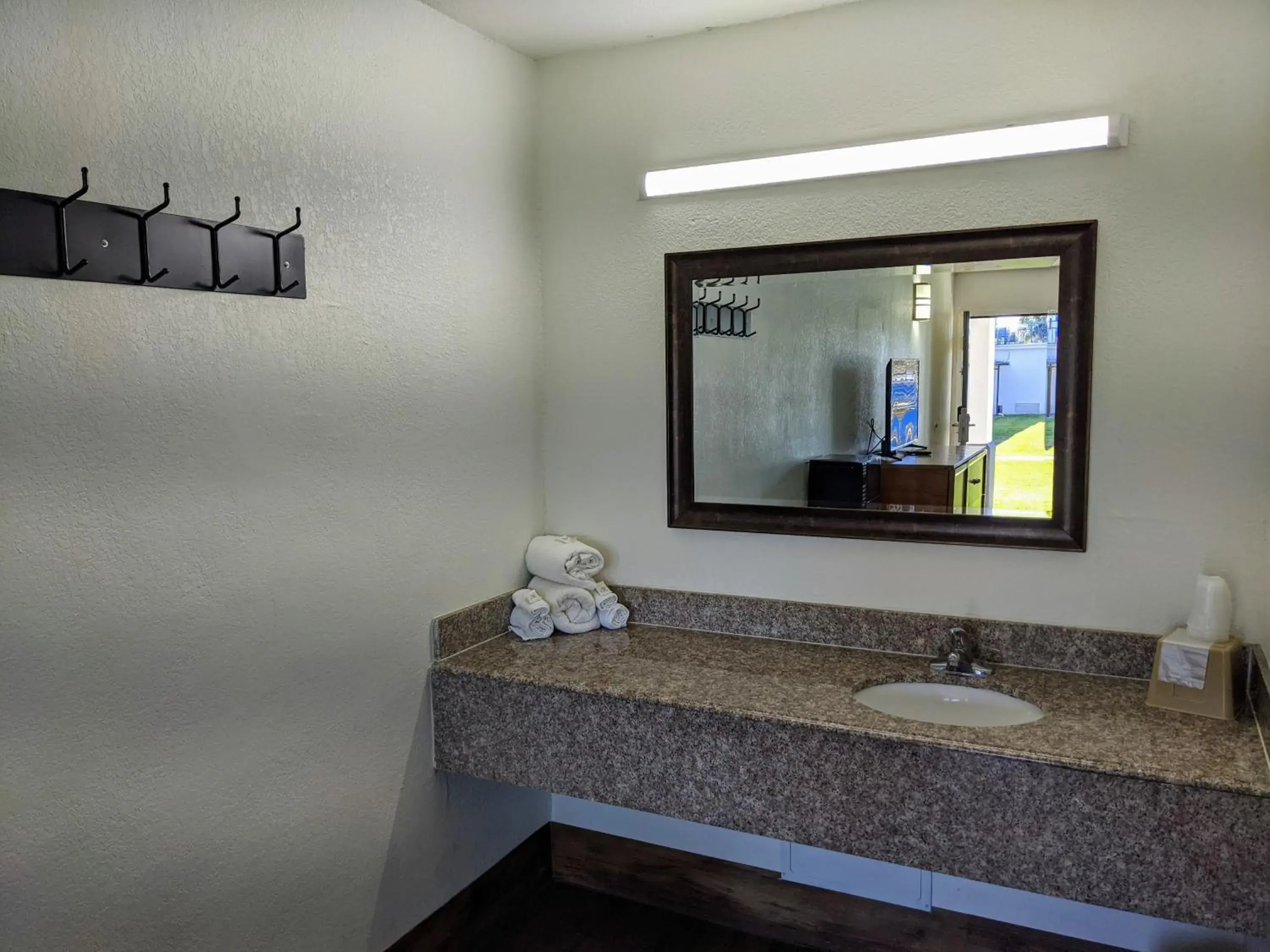 Bathroom in Garden Inn & Suites