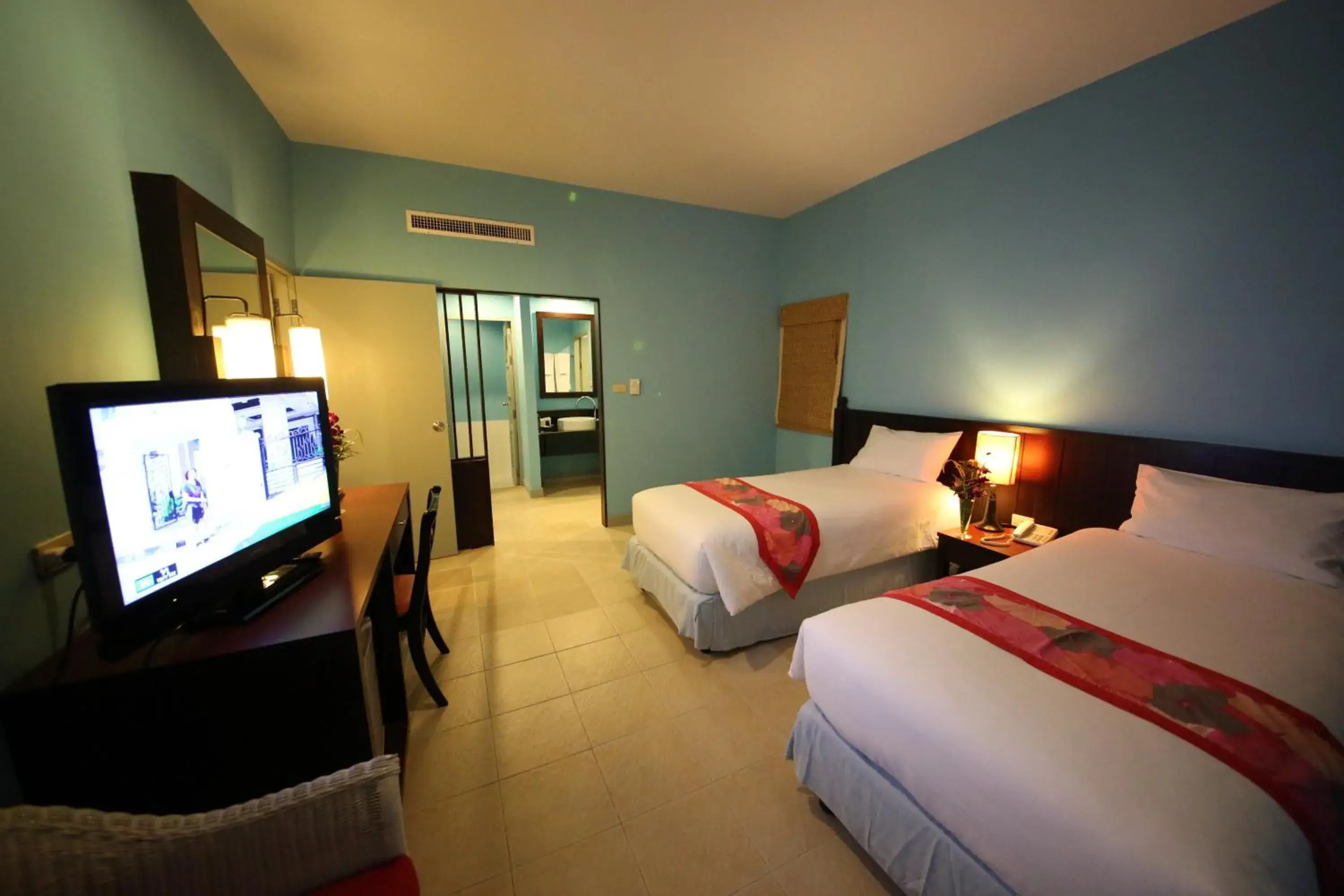 Bed, TV/Entertainment Center in The Green Park Resort - SHA Extra Plus
