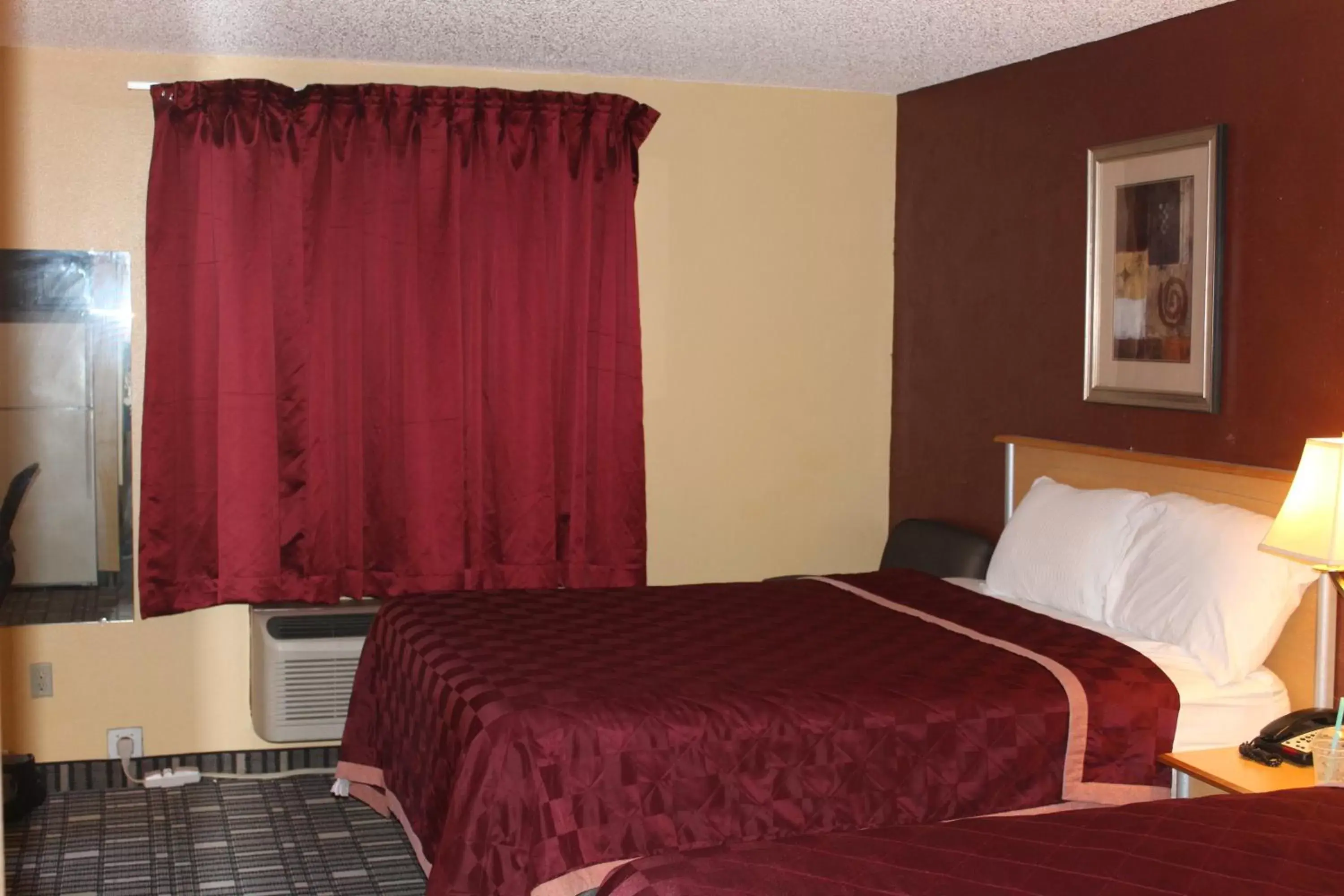 Bed in The Executive Inn & Suites Bed in The Executive Inn & Suites