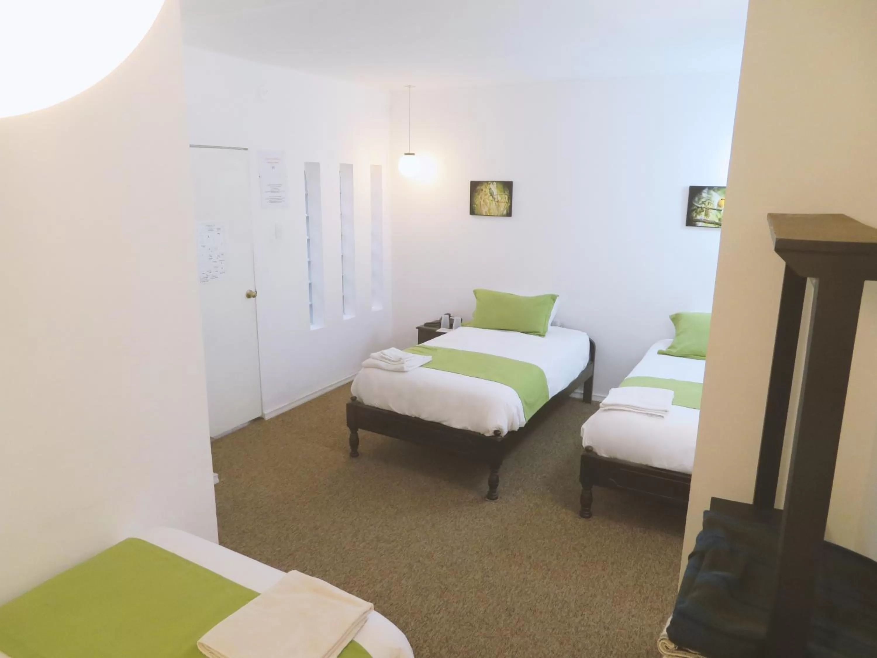 Bed in Bird Garden Guest House