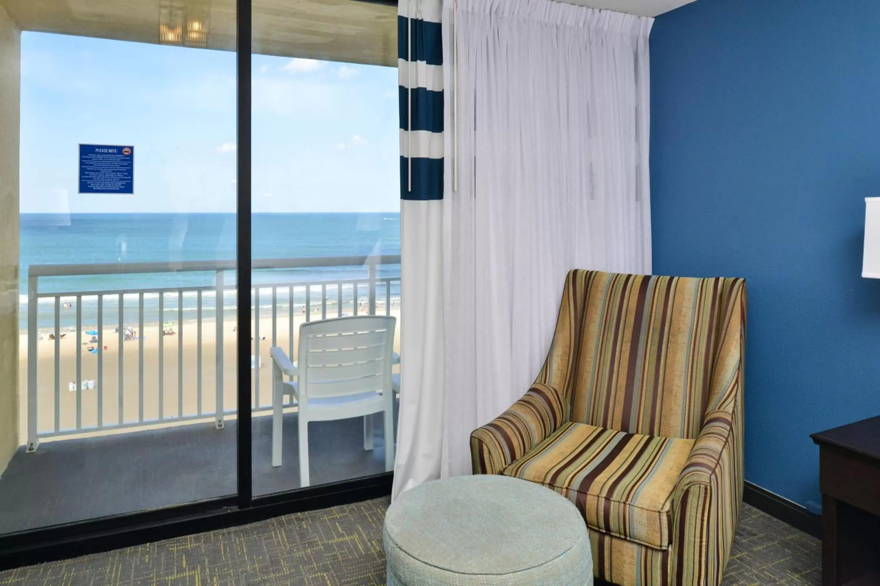 Photo of the whole room, Seating Area in Four Points by Sheraton Virginia Beach Oceanfront