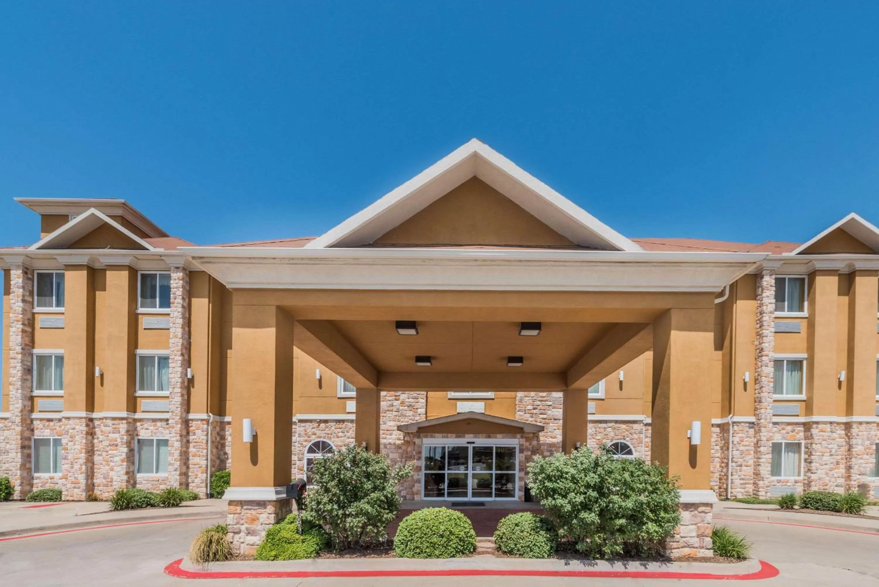Property building in Days Inn & Suites by Wyndham Cleburne TX