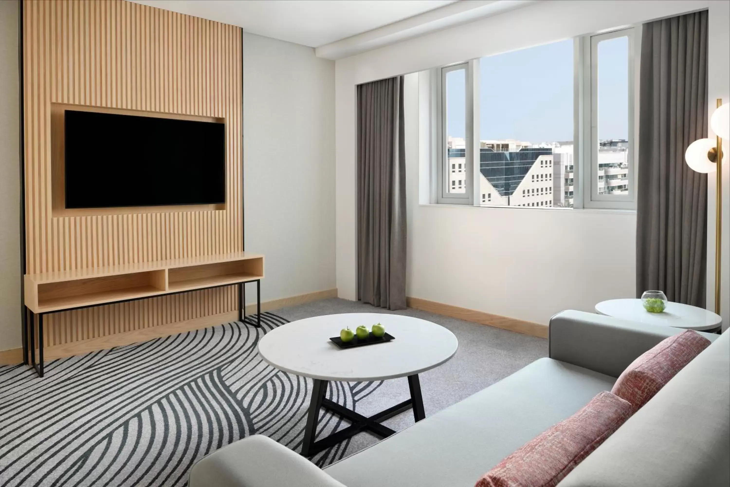 Living room, TV/Entertainment Center in Crowne Plaza - Dubai Jumeirah, an IHG Hotel