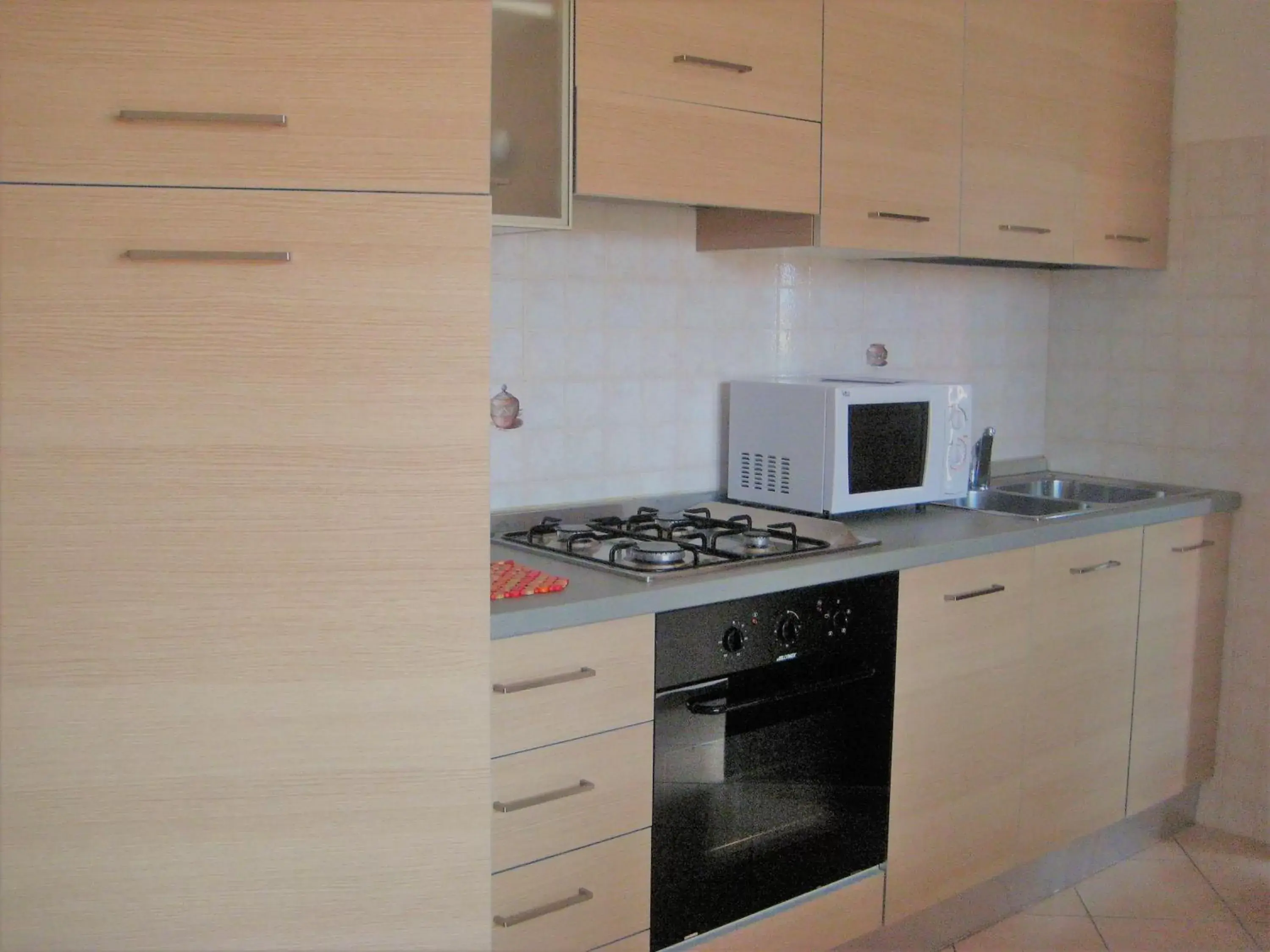 Kitchen/Kitchenette in Villaggio dei Fiori Apart- Hotel 3 Stars - Family Resort