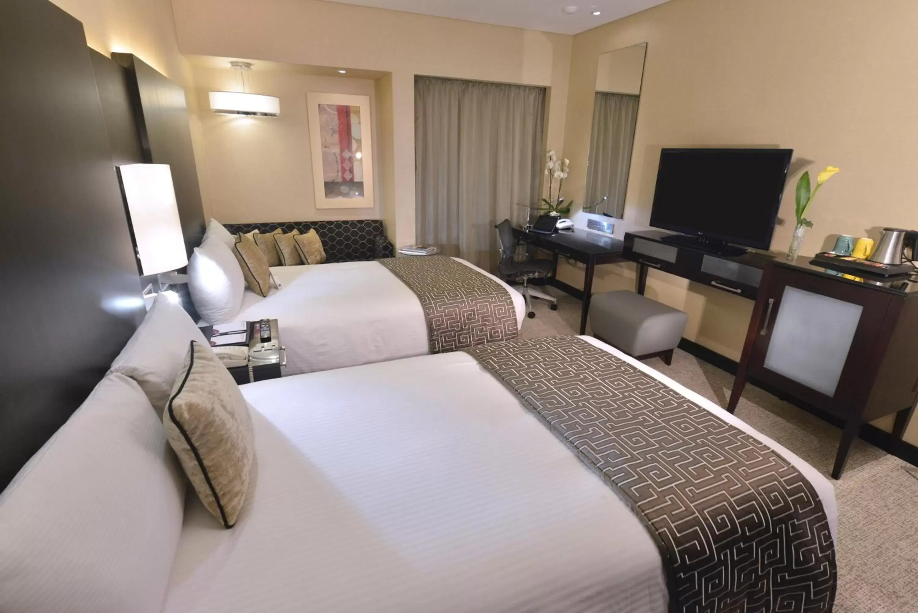 Photo of the whole room, Bed in Crowne Plaza Bahrain, an IHG Hotel