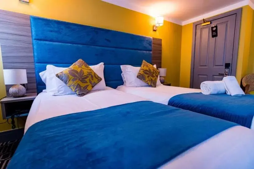 Bed in Stonecross Manor Hotel