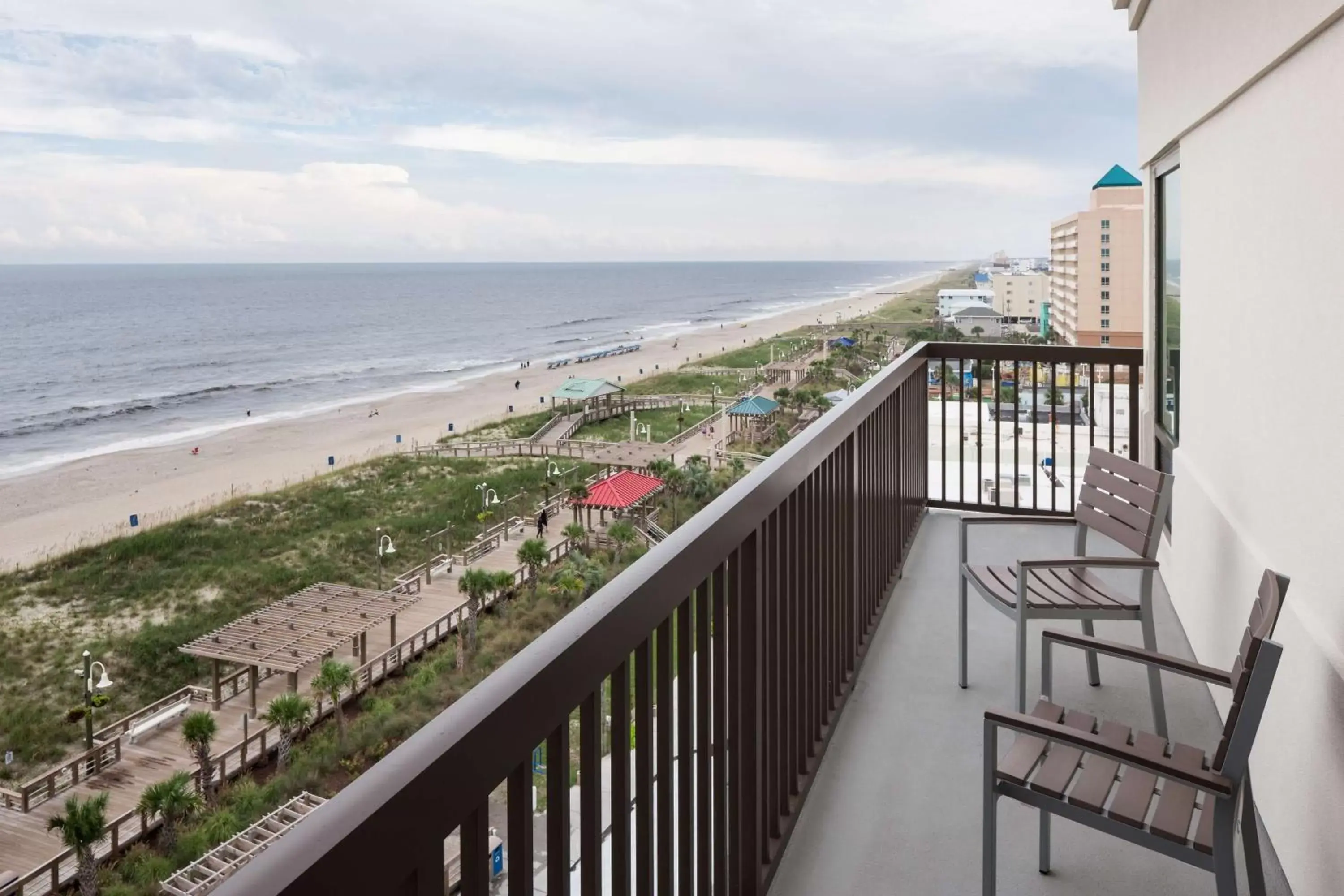 Bed, Balcony/Terrace in Hampton Inn & Suites by Hilton Carolina Beach Oceanfront