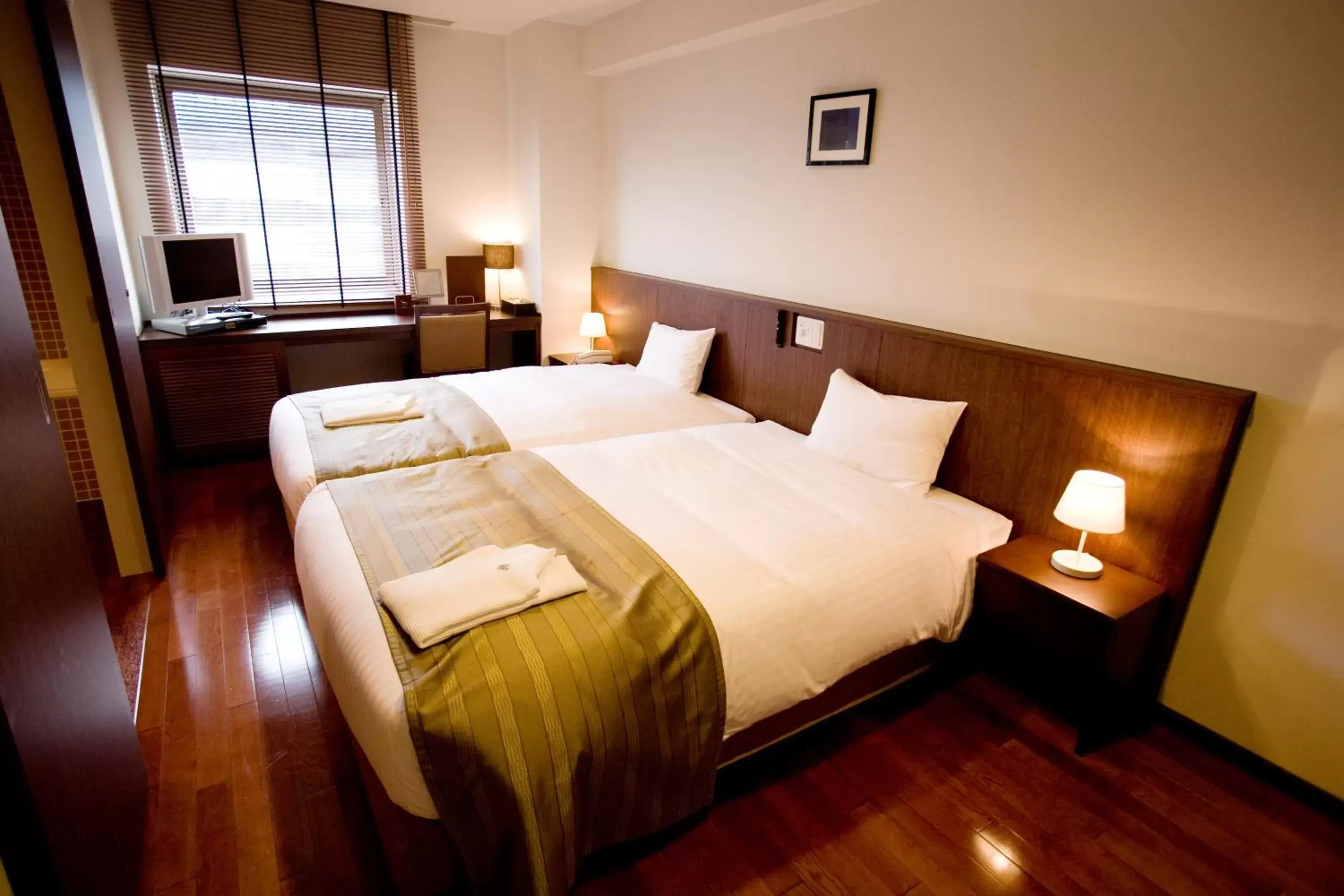 Bed in Sutton Hotel Hakata City