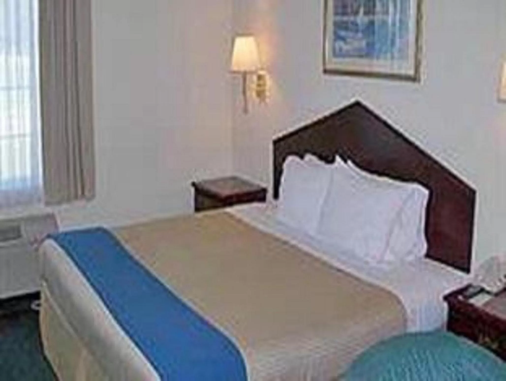 Bed in Ramada by Wyndham Williams