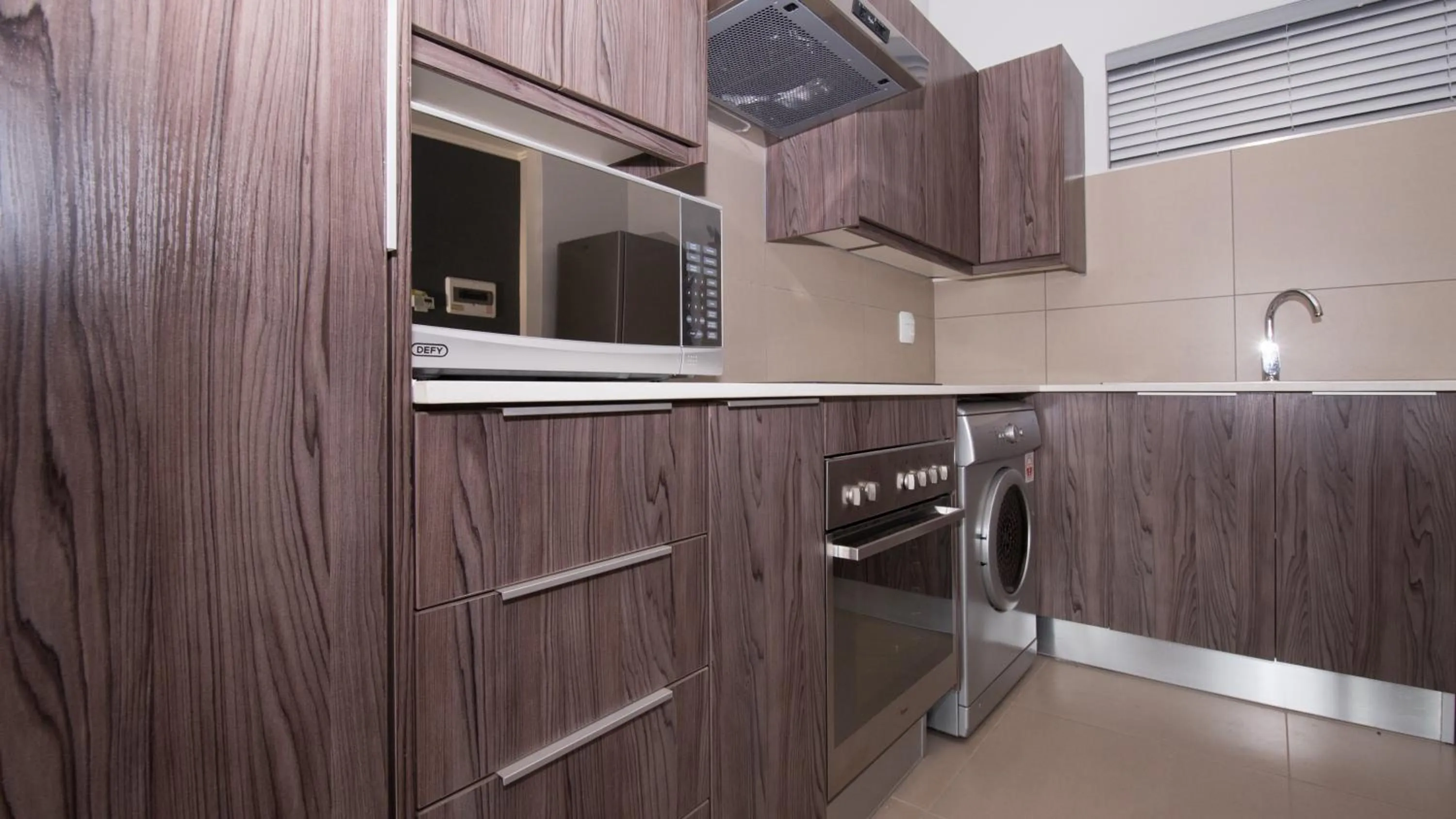 Kitchen or kitchenette in Odyssey Luxury Apartments - Back Up Generator
