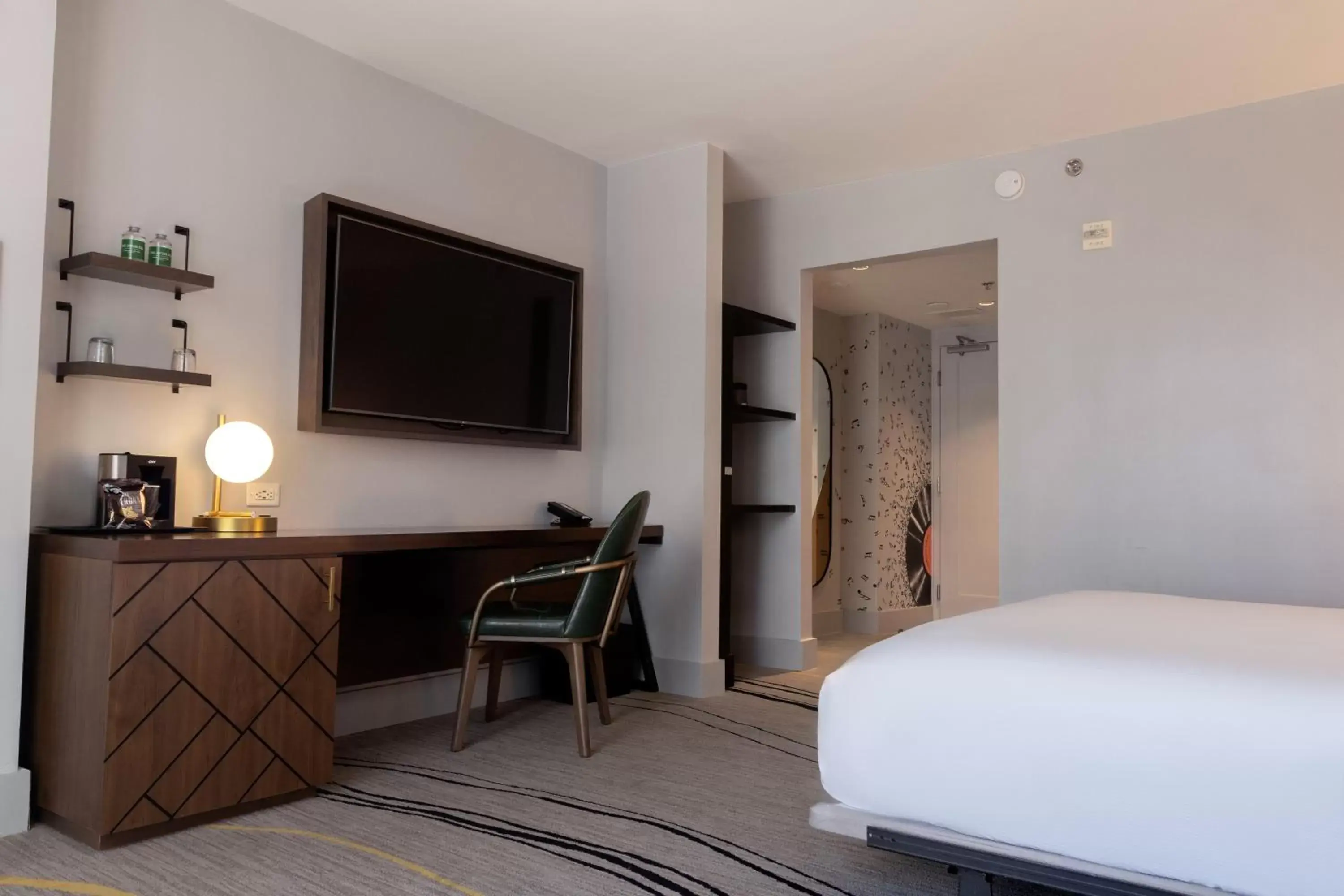 Bed, TV/Entertainment Center in The Starling Atlanta Midtown, Curio Collection by Hilton