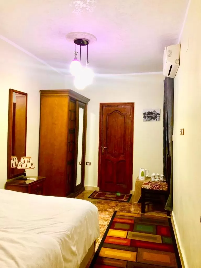 Sphinx palace pyramids view