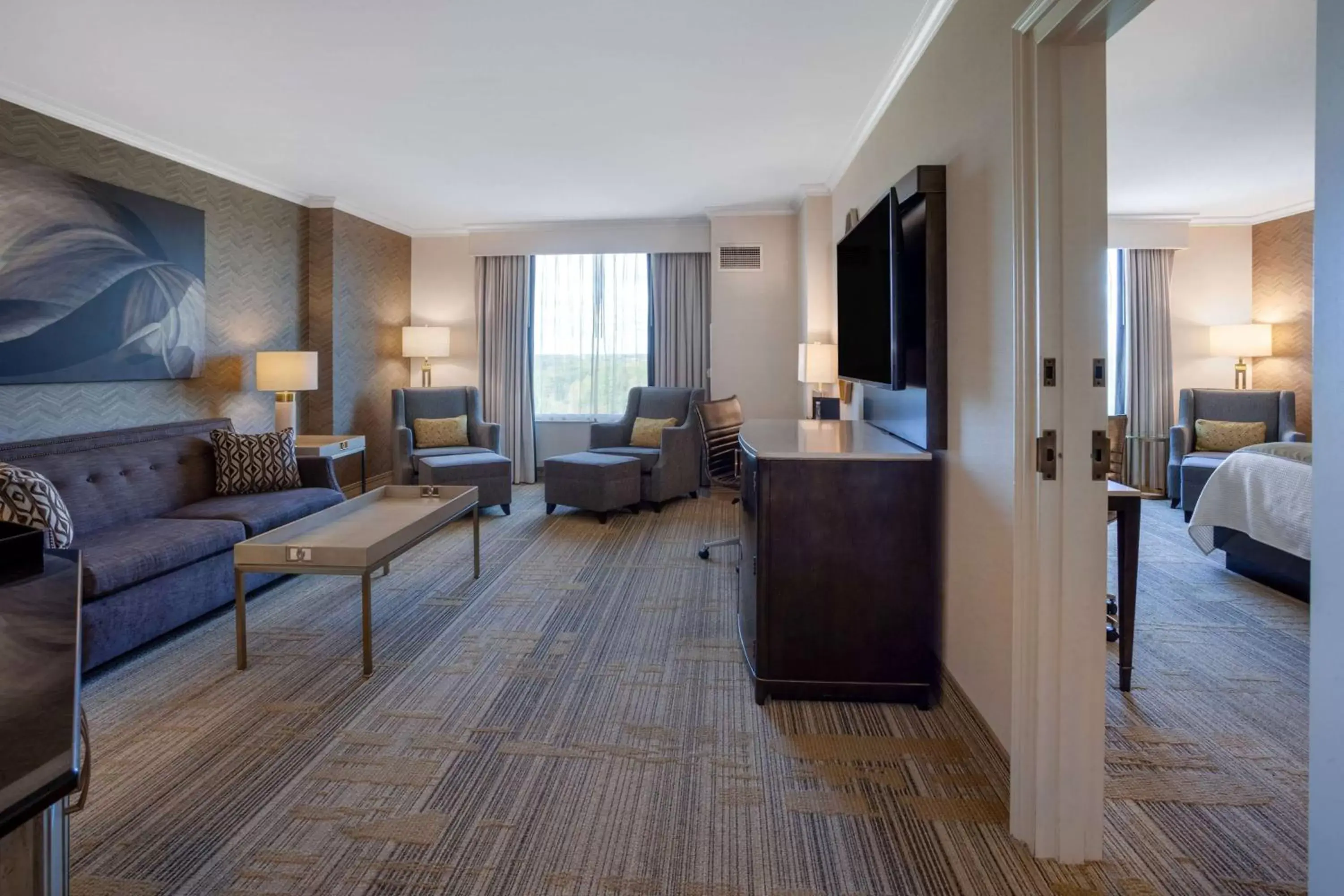 Bed, Seating Area in Grandover Resort & Spa, a Wyndham Grand Hotel