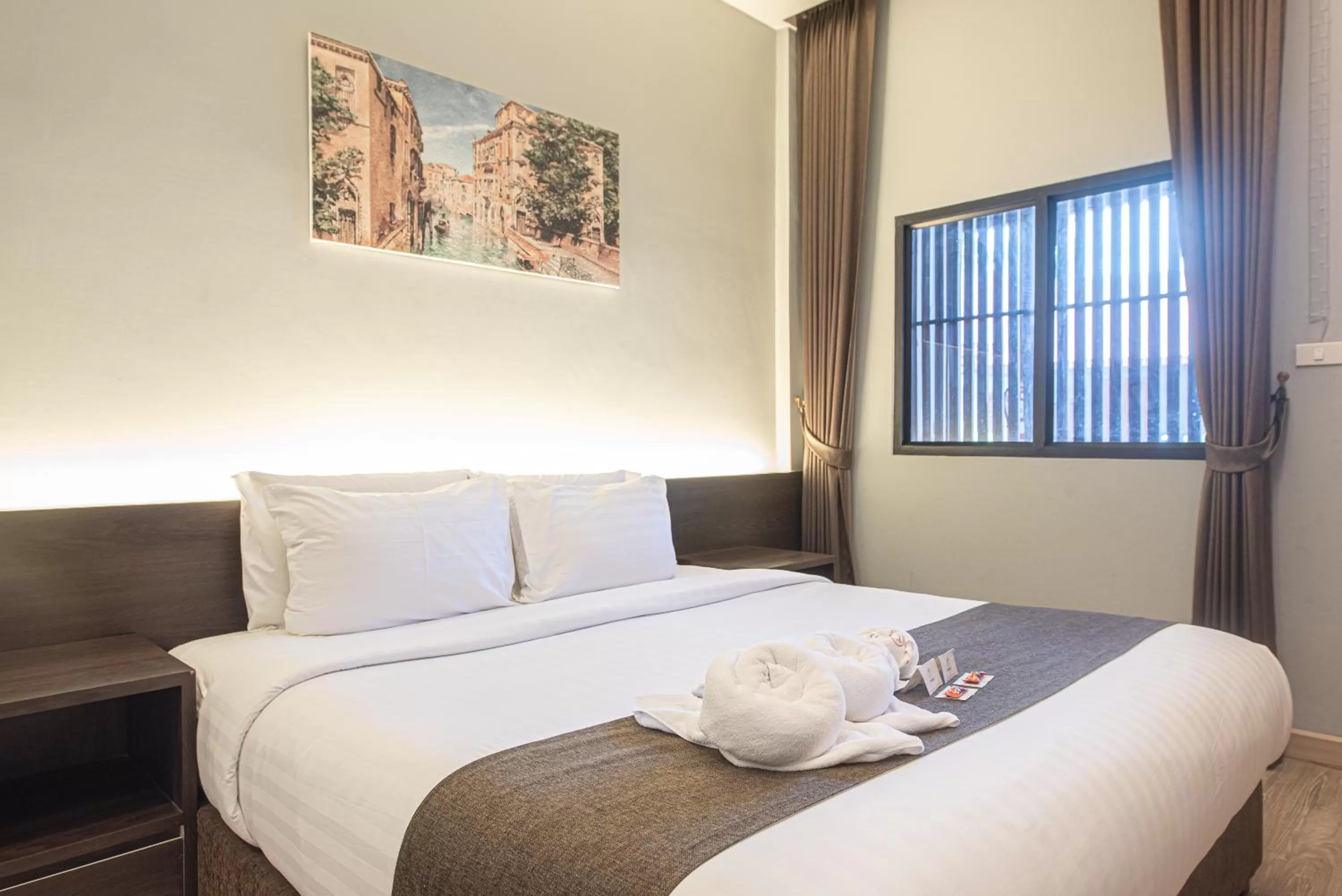 Bed in Tarnsiri Boutique Resort