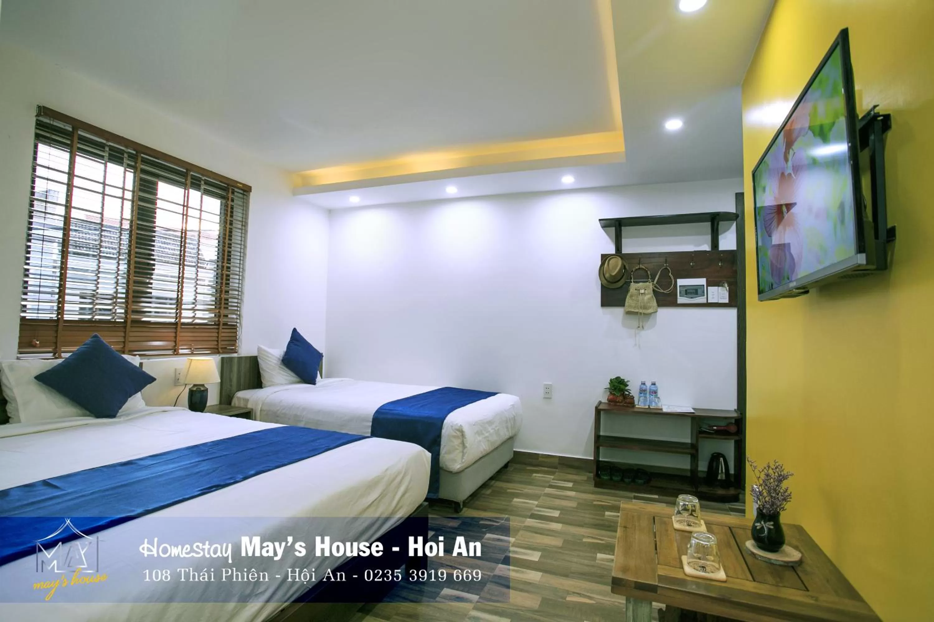 Communal lounge/ TV room, Bed in May's House Hoi An