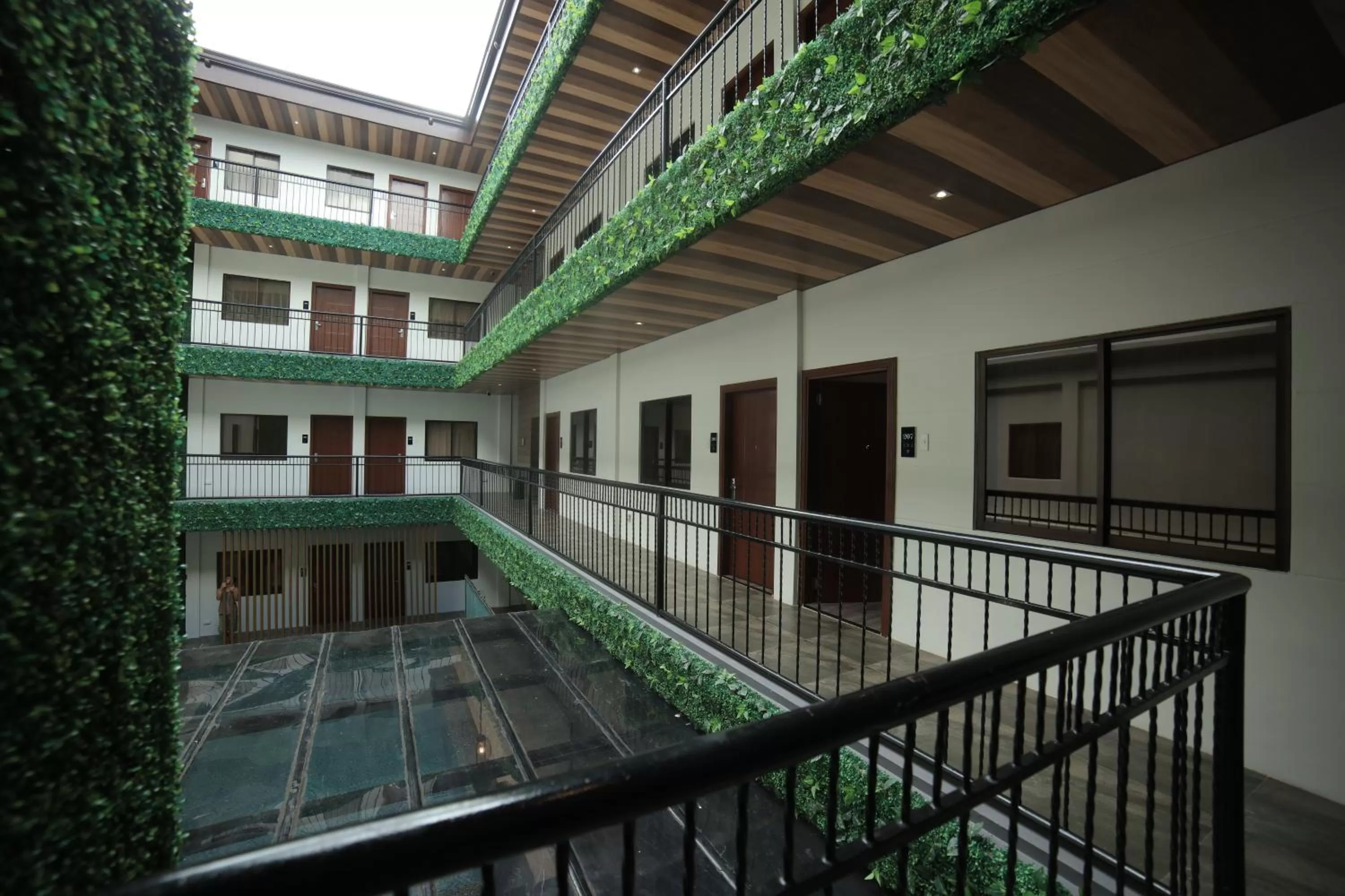 Property building in SureStay Plus Hotel by Best Western AC LUXE Angeles City