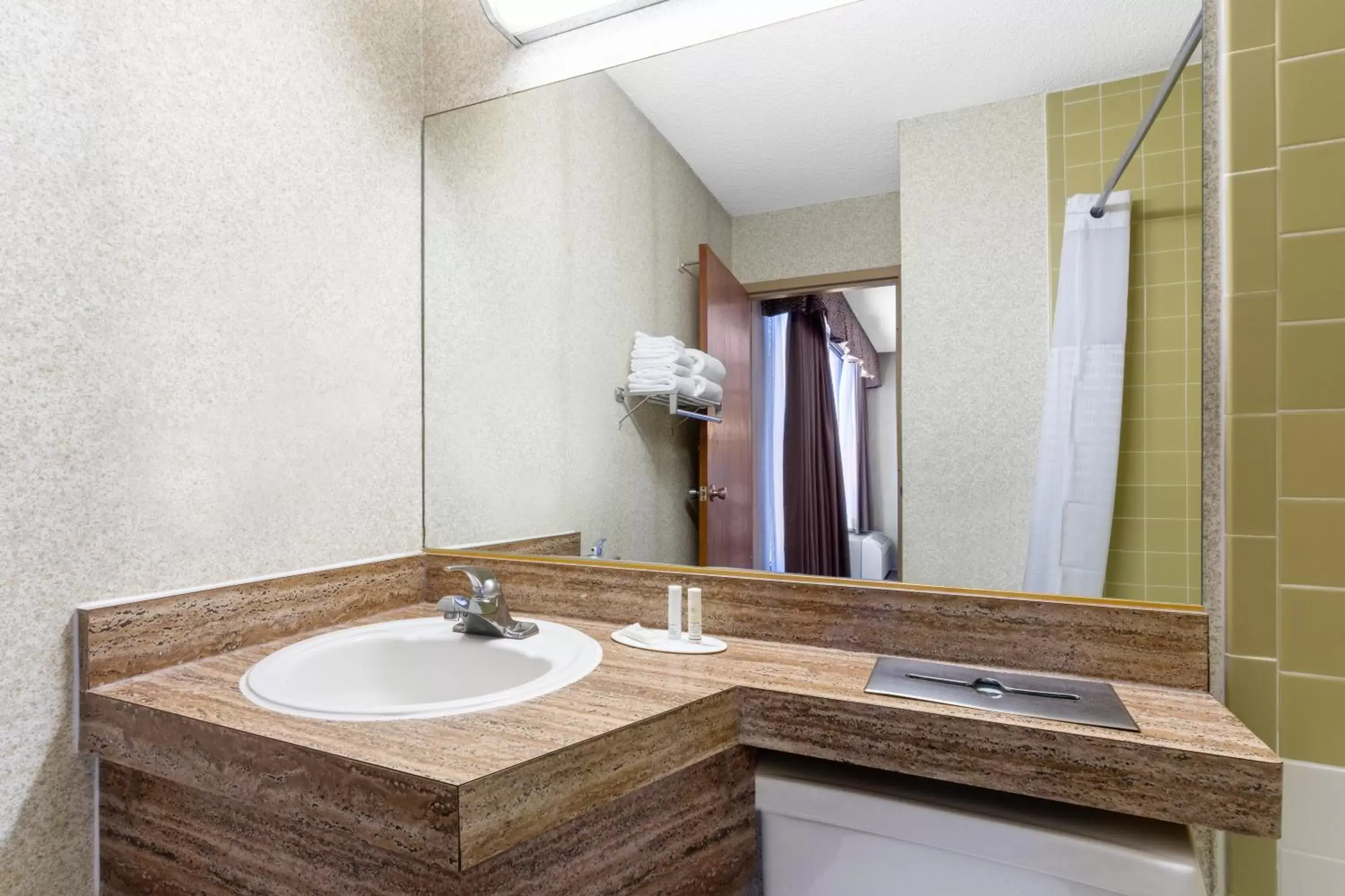 Bathroom in Ramada by Wyndham Reno Hotel & Casino