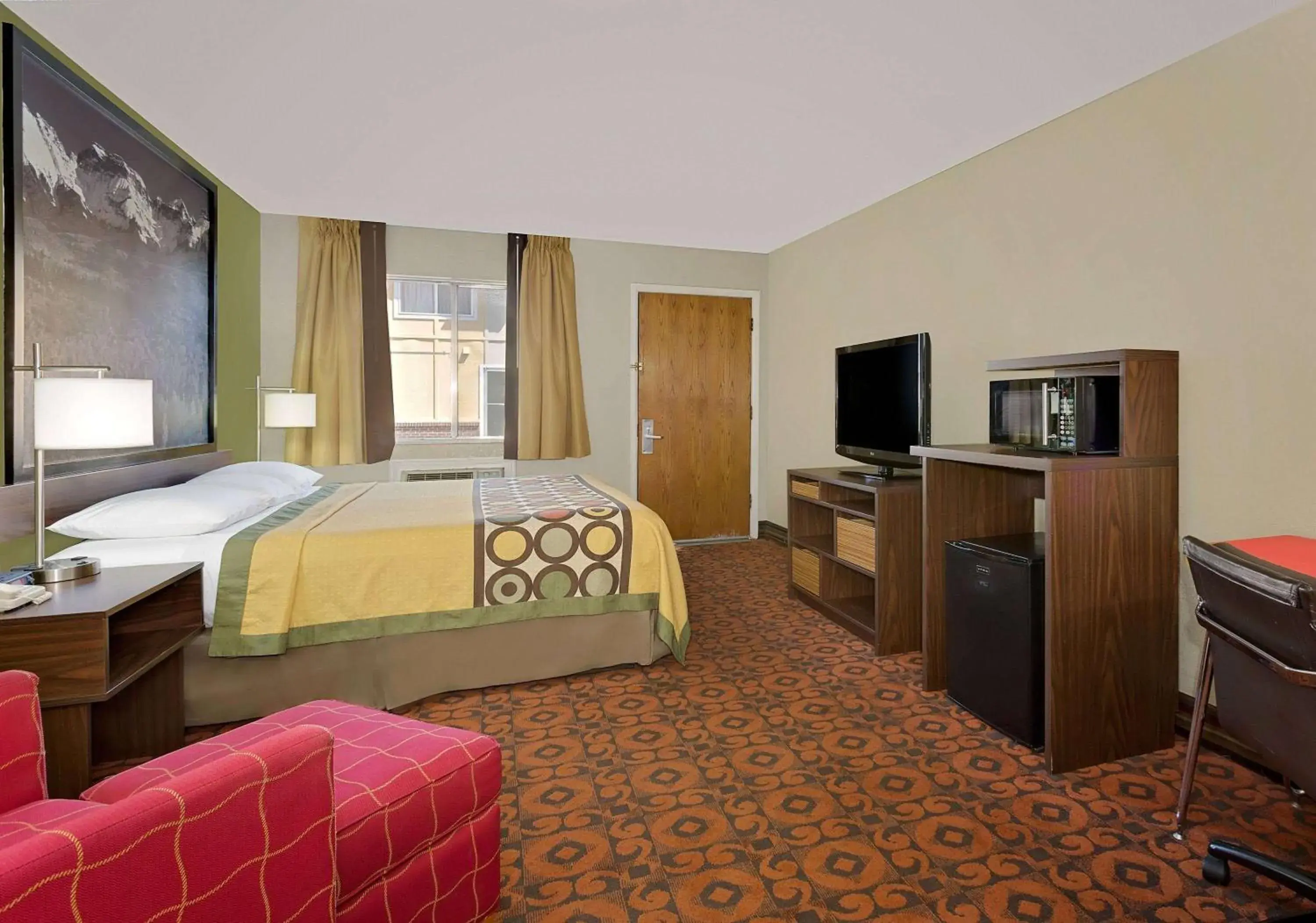 Photo of the whole room, TV/Entertainment Center in Super 8 by Wyndham Denver Central