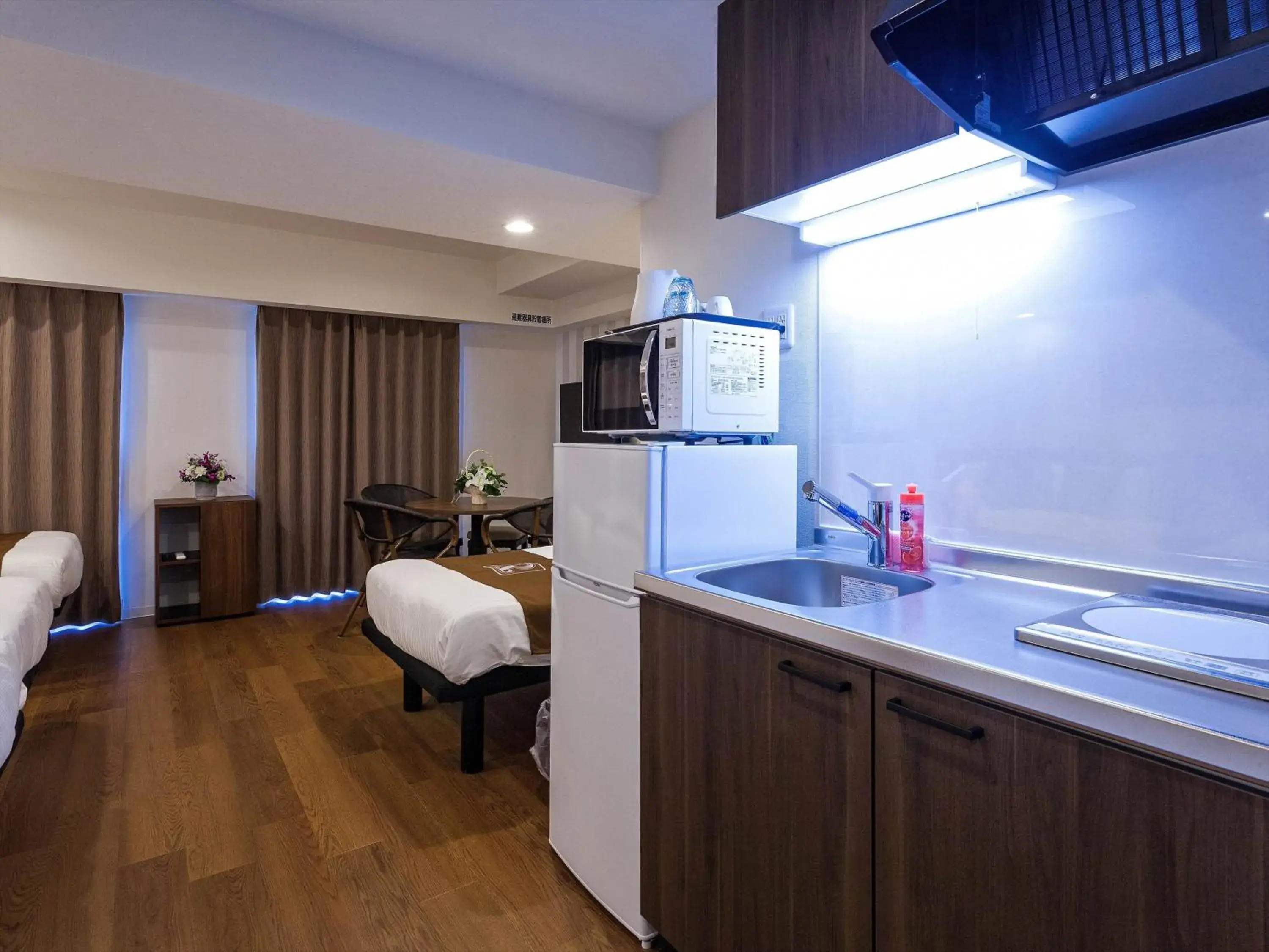 Kitchen/Kitchenette in Kariyushi COndominium Resort Naha Living Inn Asahibashiekimae Annex and Premier