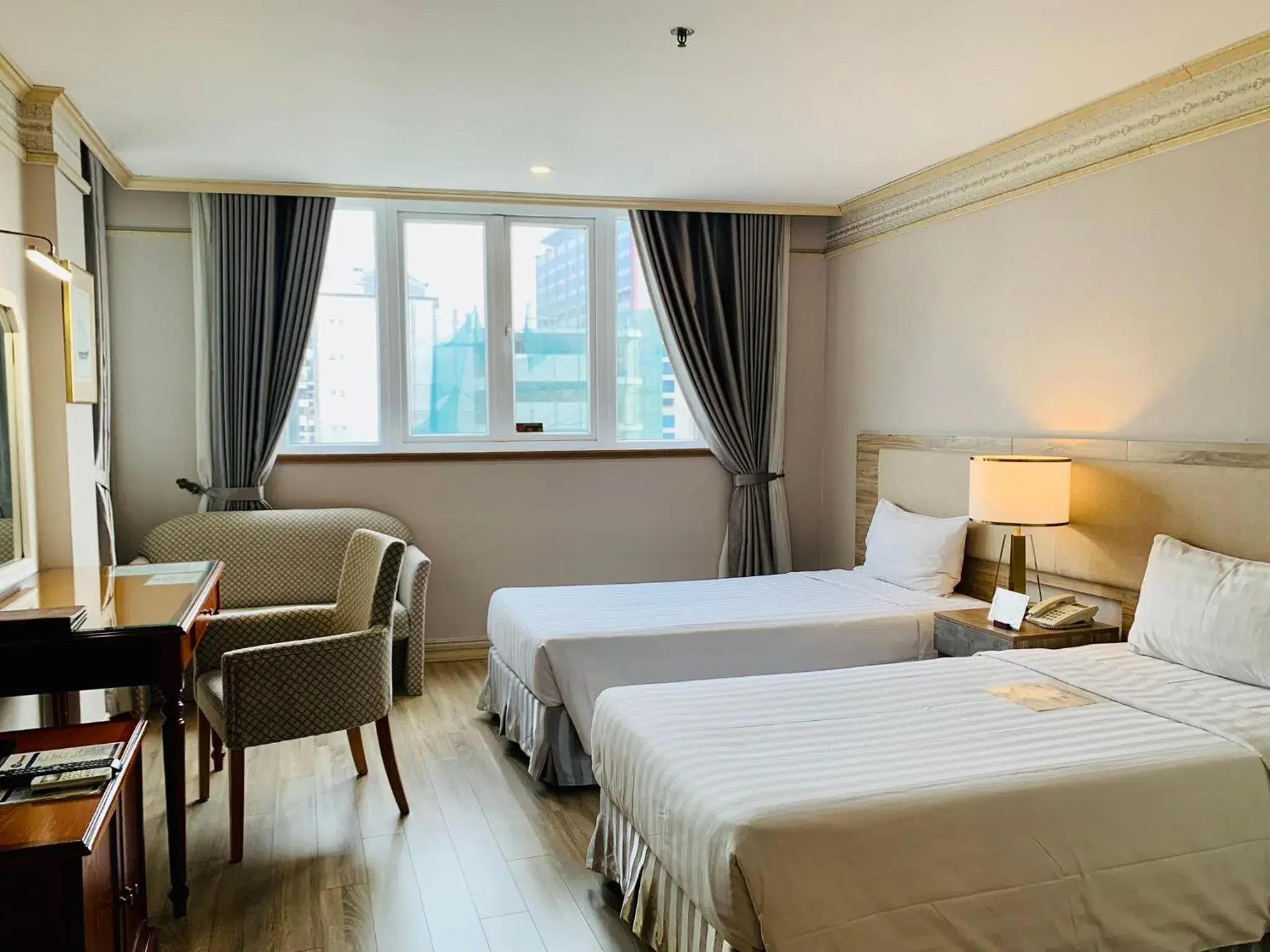 Bed in Lotus Saigon Hotel