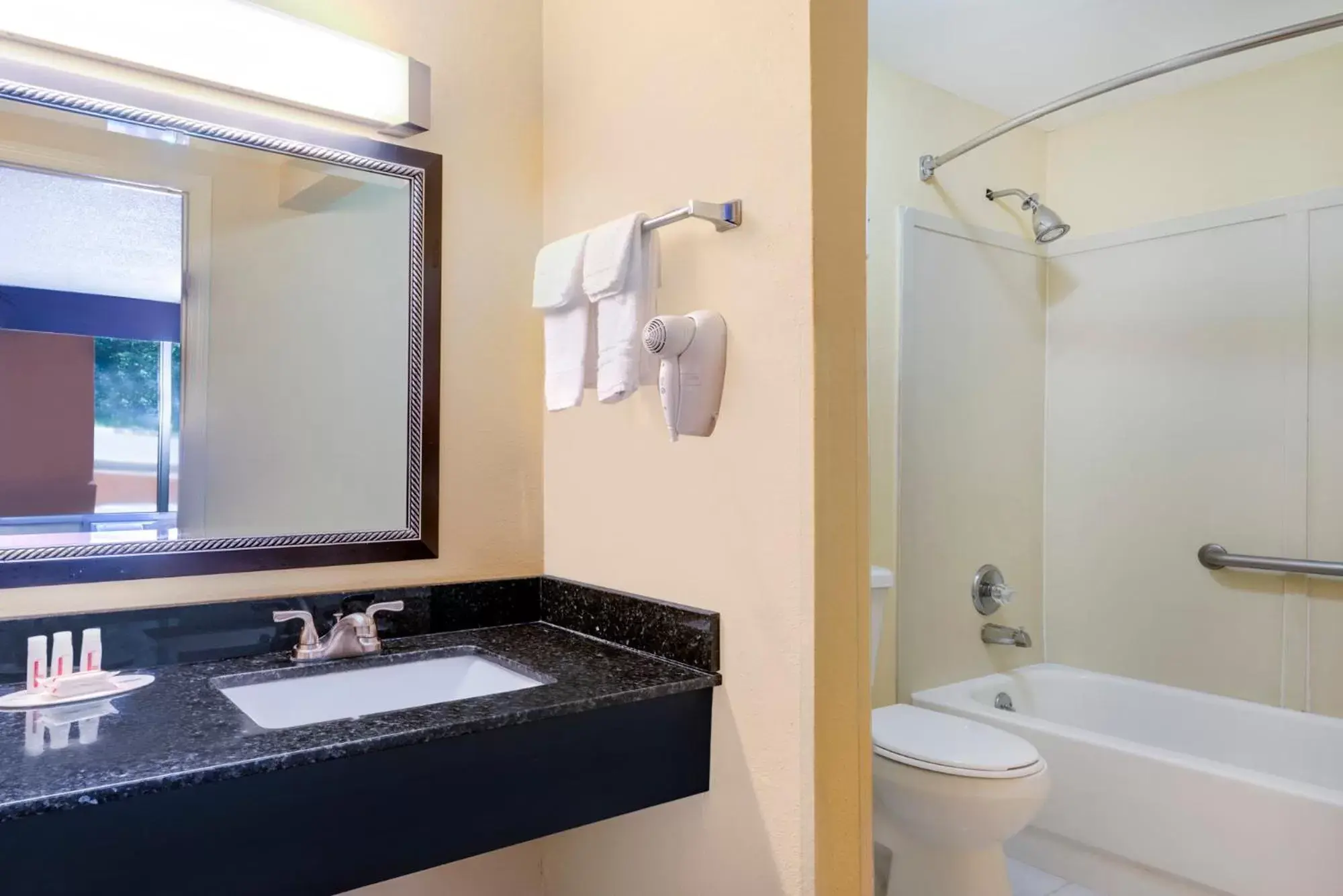 Bathroom in Days Inn by Wyndham Knoxville East