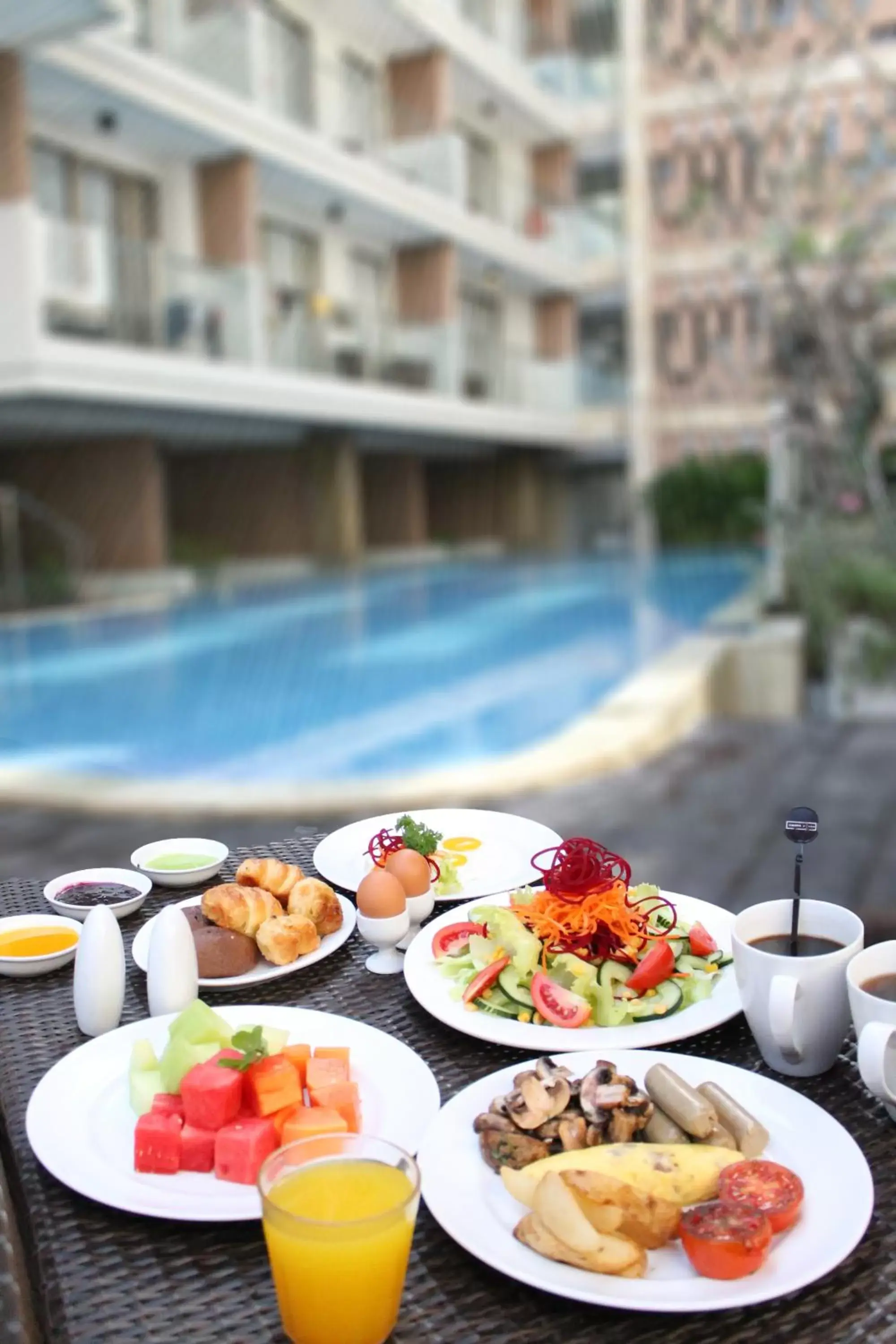 Buffet breakfast, Swimming Pool in Harper Kuta Hotel by ASTON