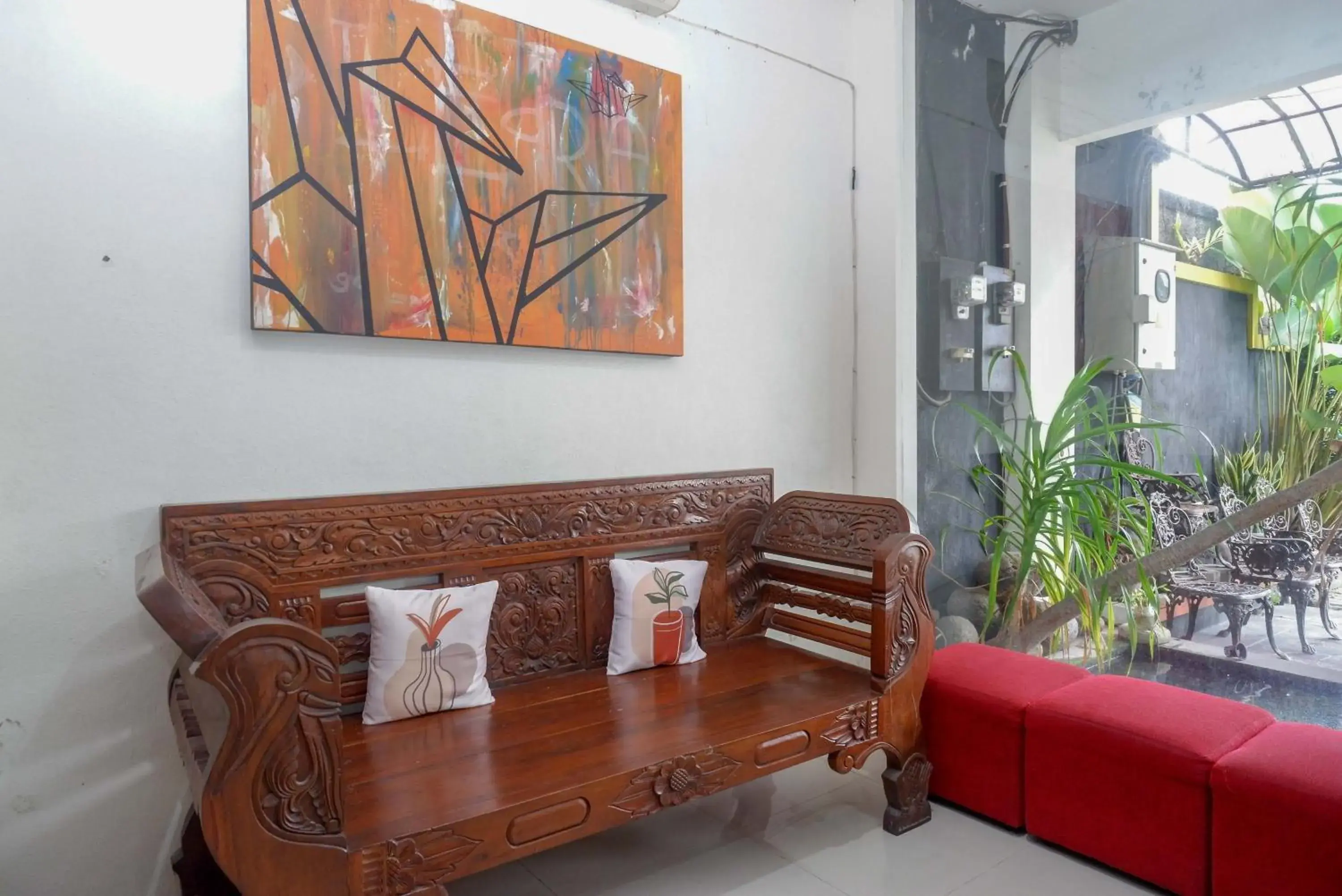 Seating Area in RedDoorz Syariah At Namira Hotel