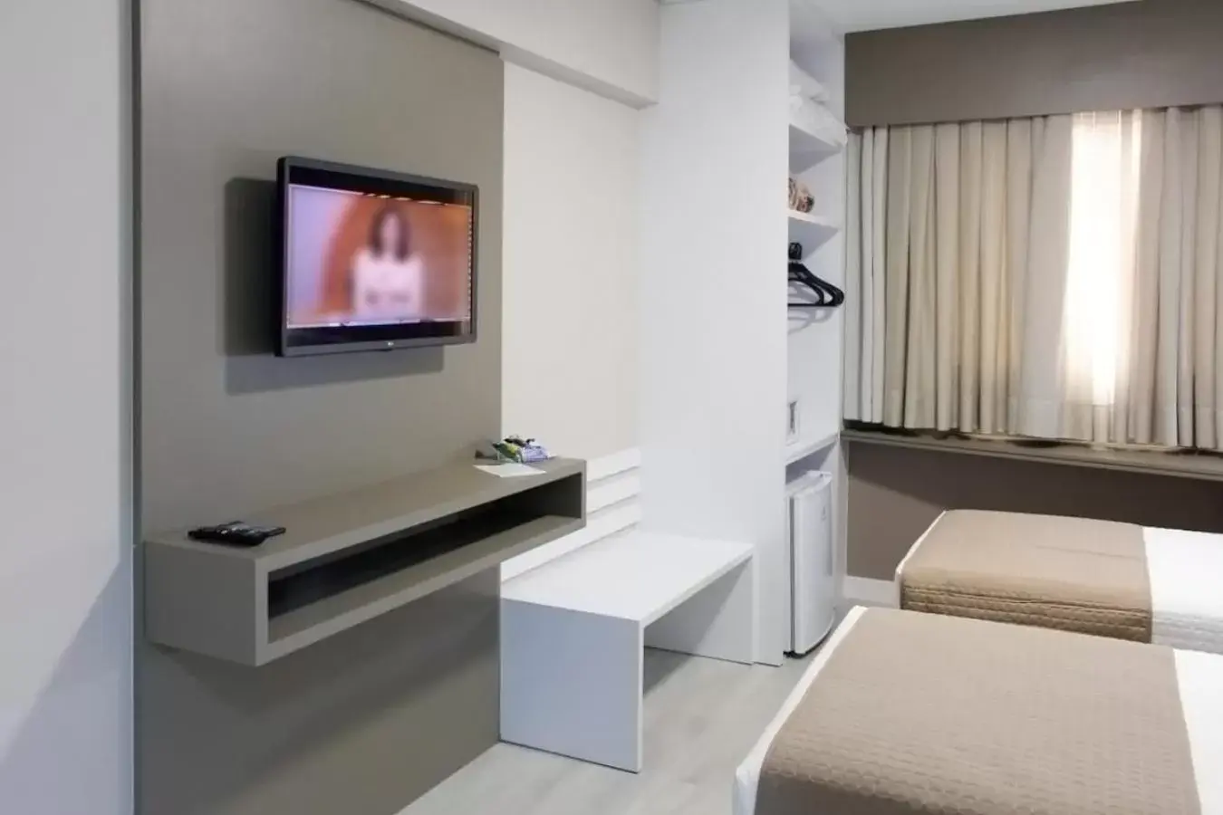 Bed, TV/Entertainment Center in Tri Hotel Executive Indaial