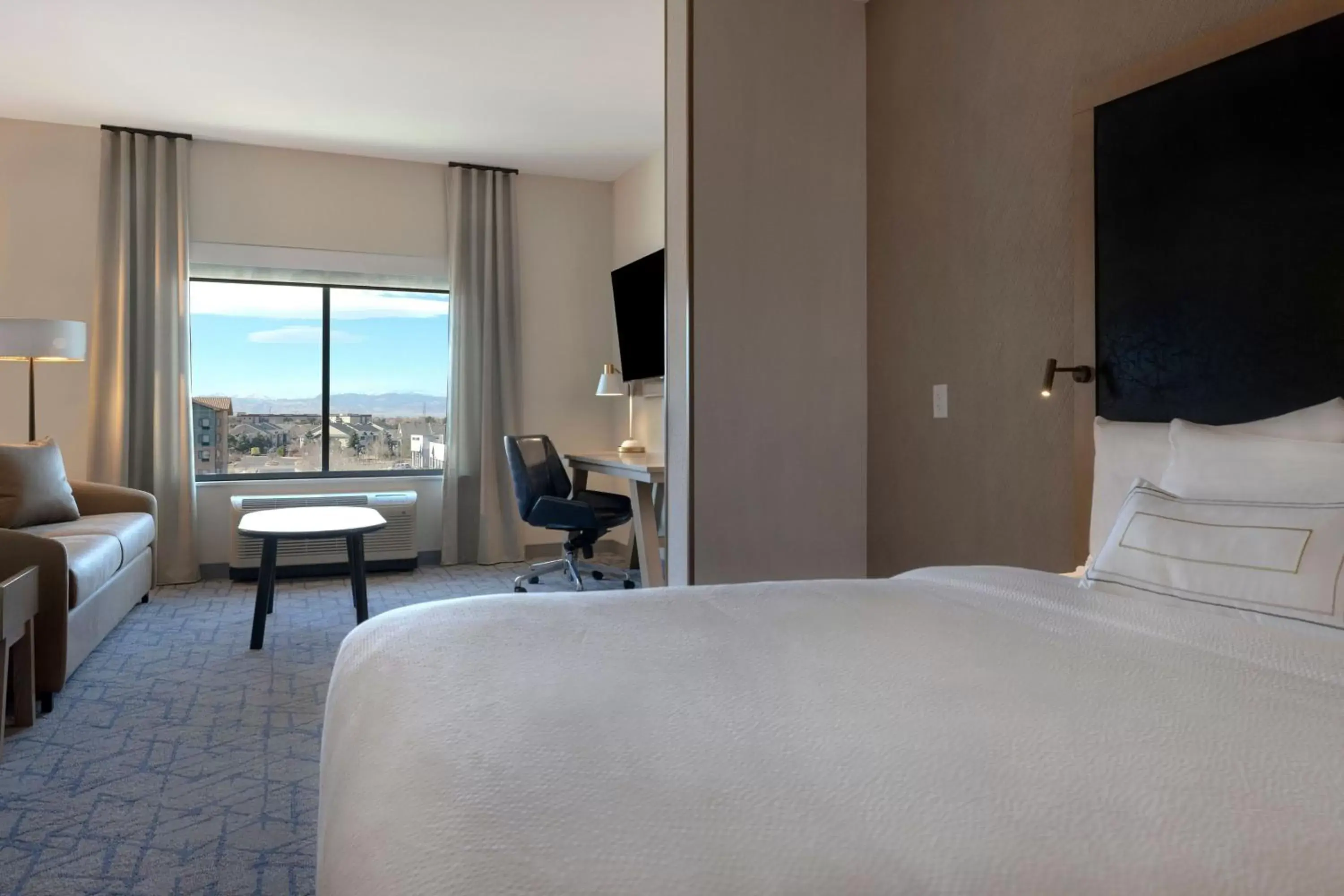 Living room, Bed in Fairfield by Marriott Inn & Suites Denver Airport at Gateway Park