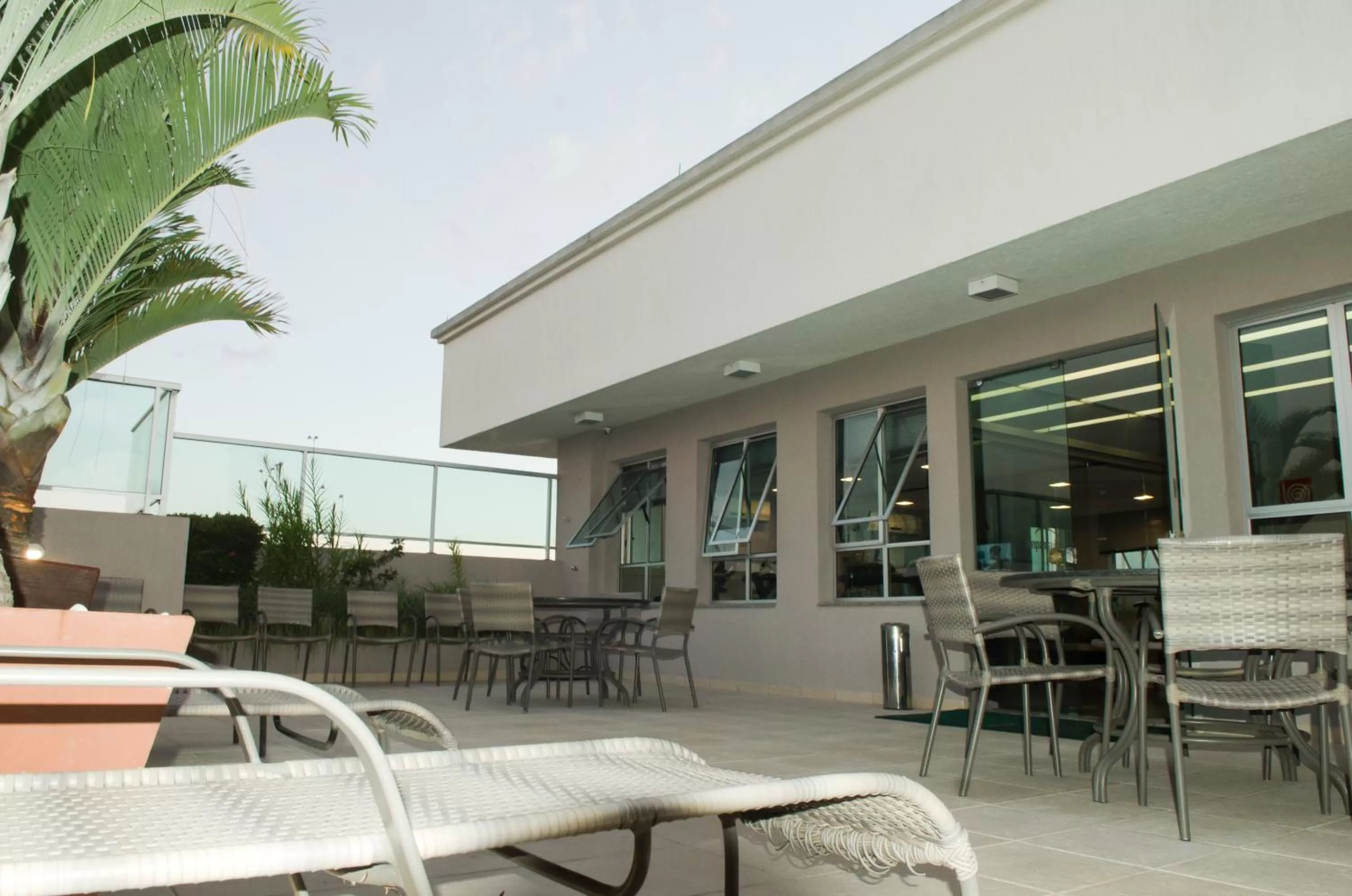 Balcony/Terrace in Ímpar Suítes Cidade Nova