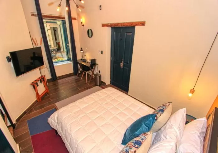 Bed in Antigua Trece Hotel Fusión