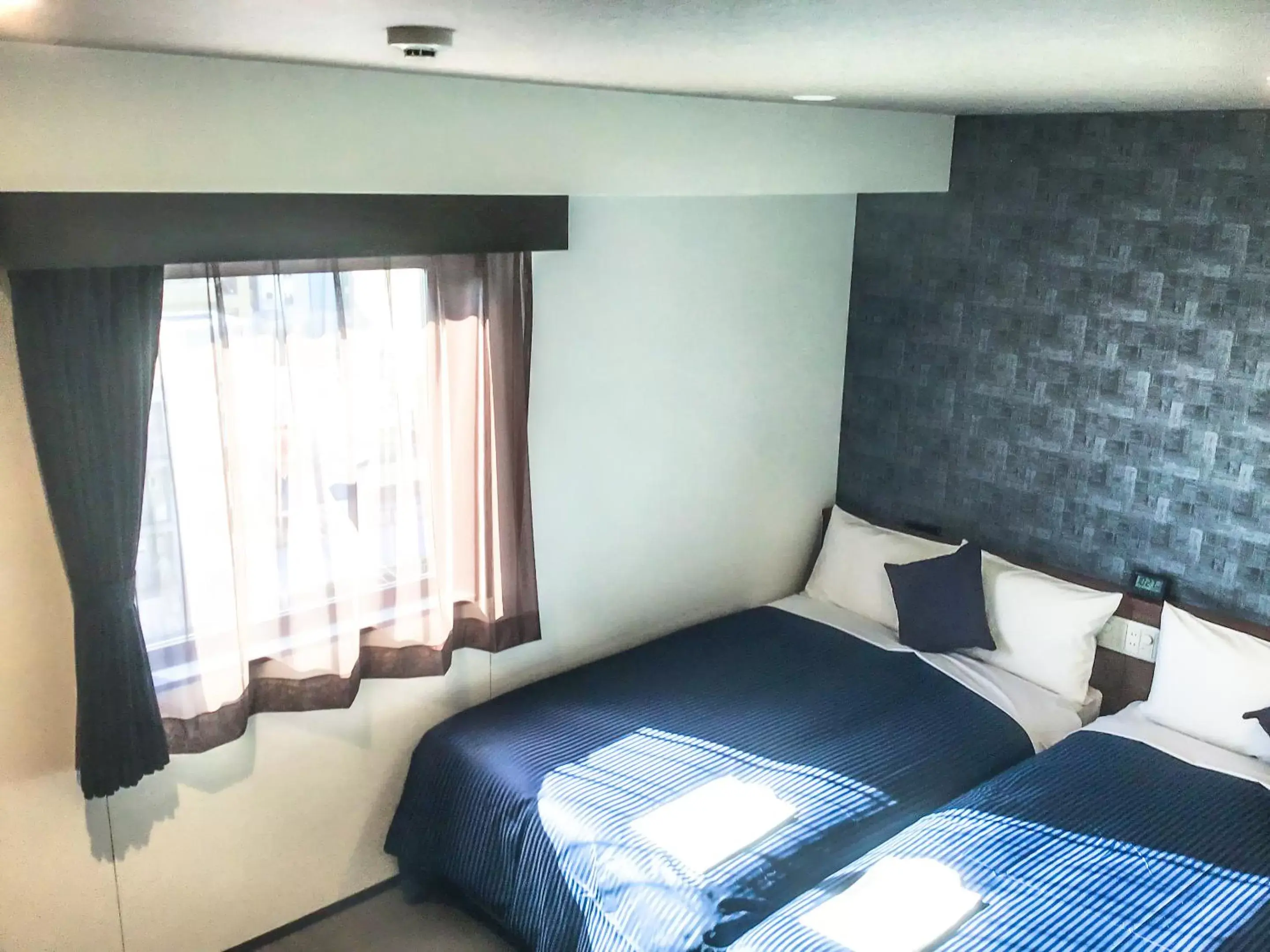 Bed in HOTEL LiVEMAX Okayama