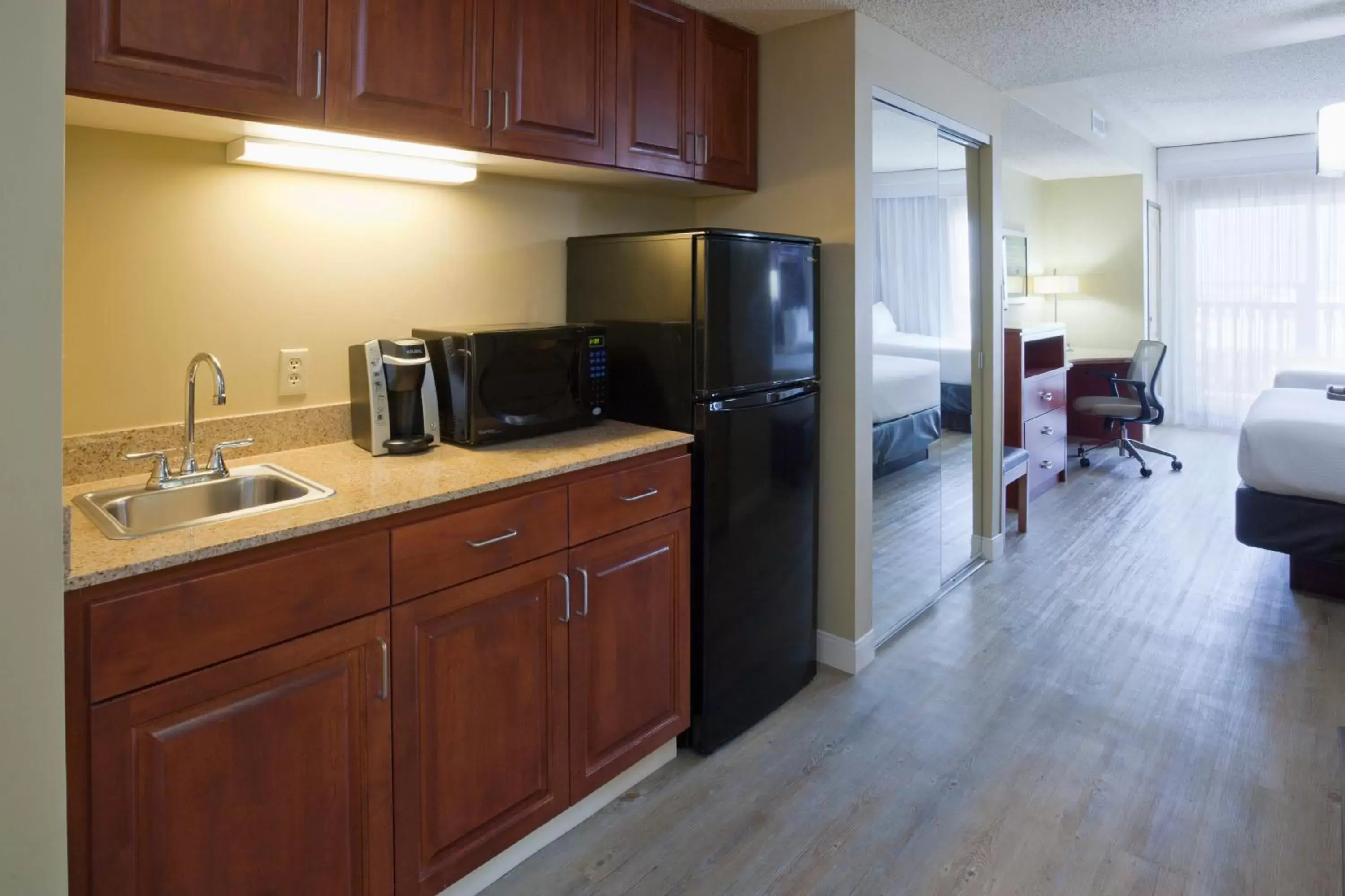 Photo of the whole room, Kitchen/Kitchenette in Holiday Inn Hotel & Suites Maple Grove Northwest Minneapolis-Arbor Lakes, an IHG Hotel
