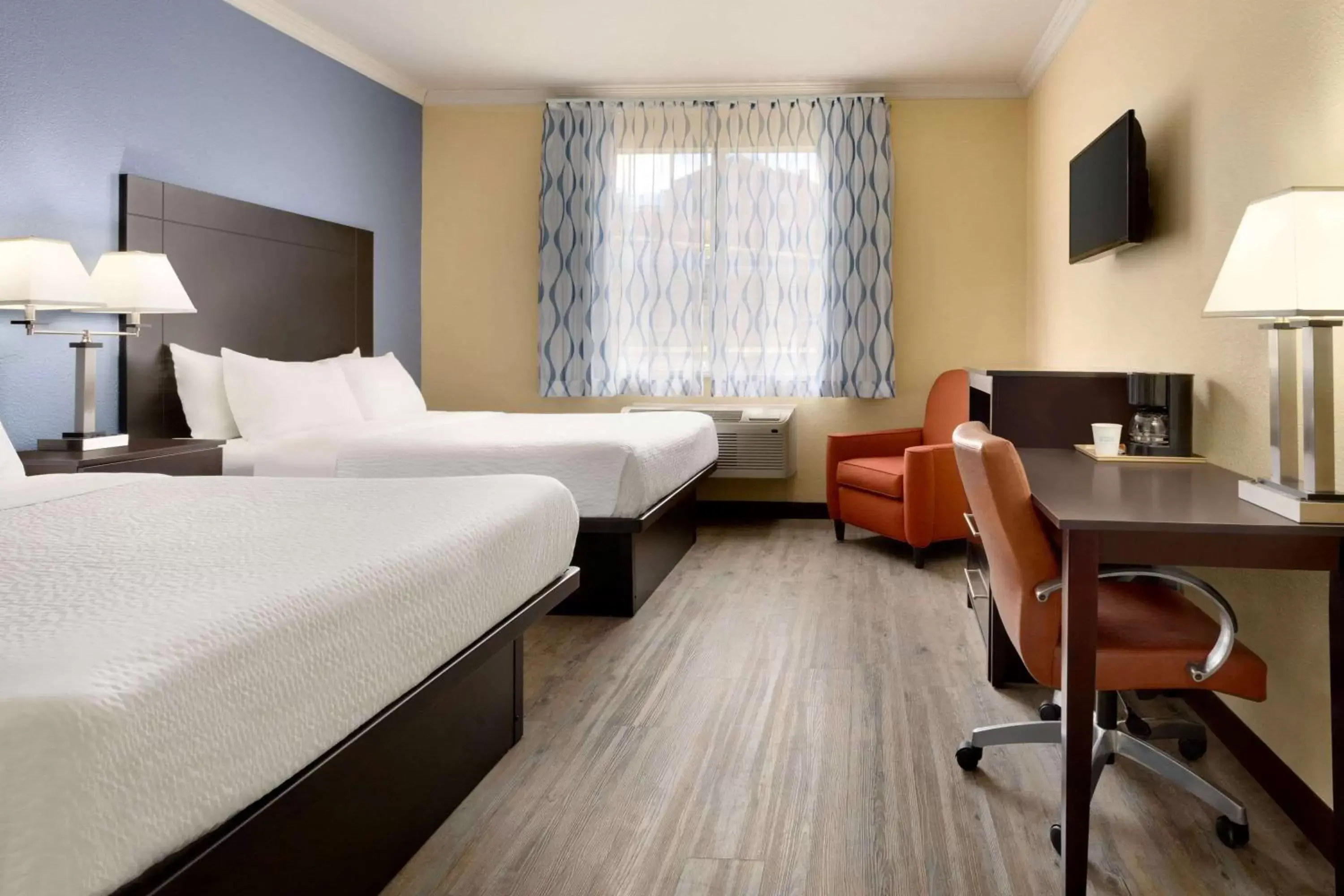 Photo of the whole room in Days Inn & Suites by Wyndham DFW Airport South-Euless