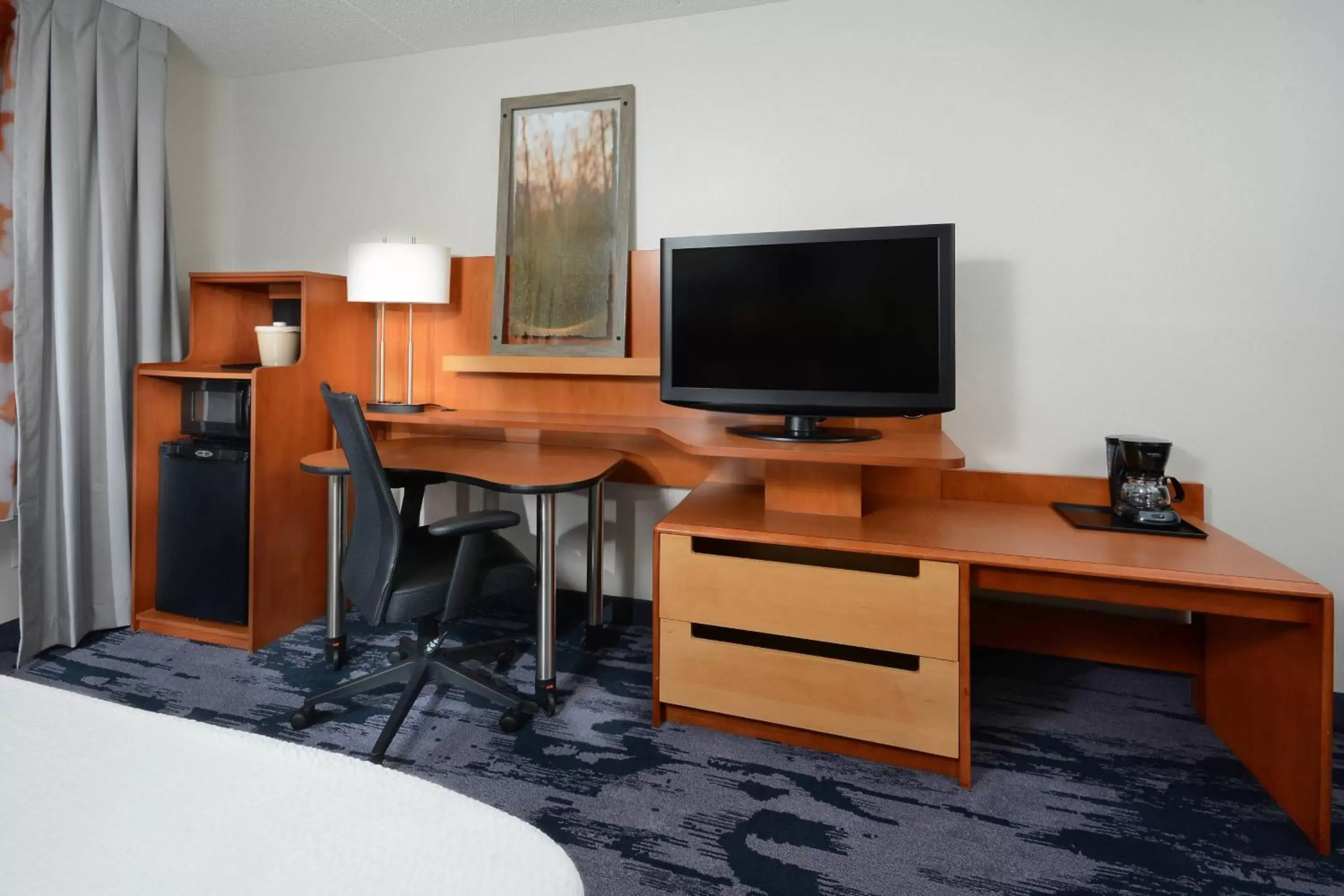 Photo of the whole room, TV/Entertainment Center in Fairfield Inn & Suites by Marriott Charlottesville North