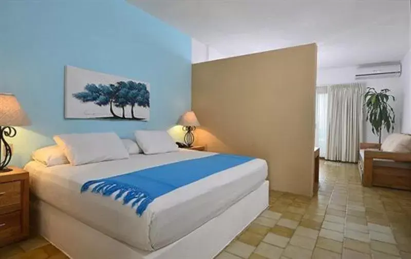 Bed in Emperador Vallarta Beachfront Hotel and Suites