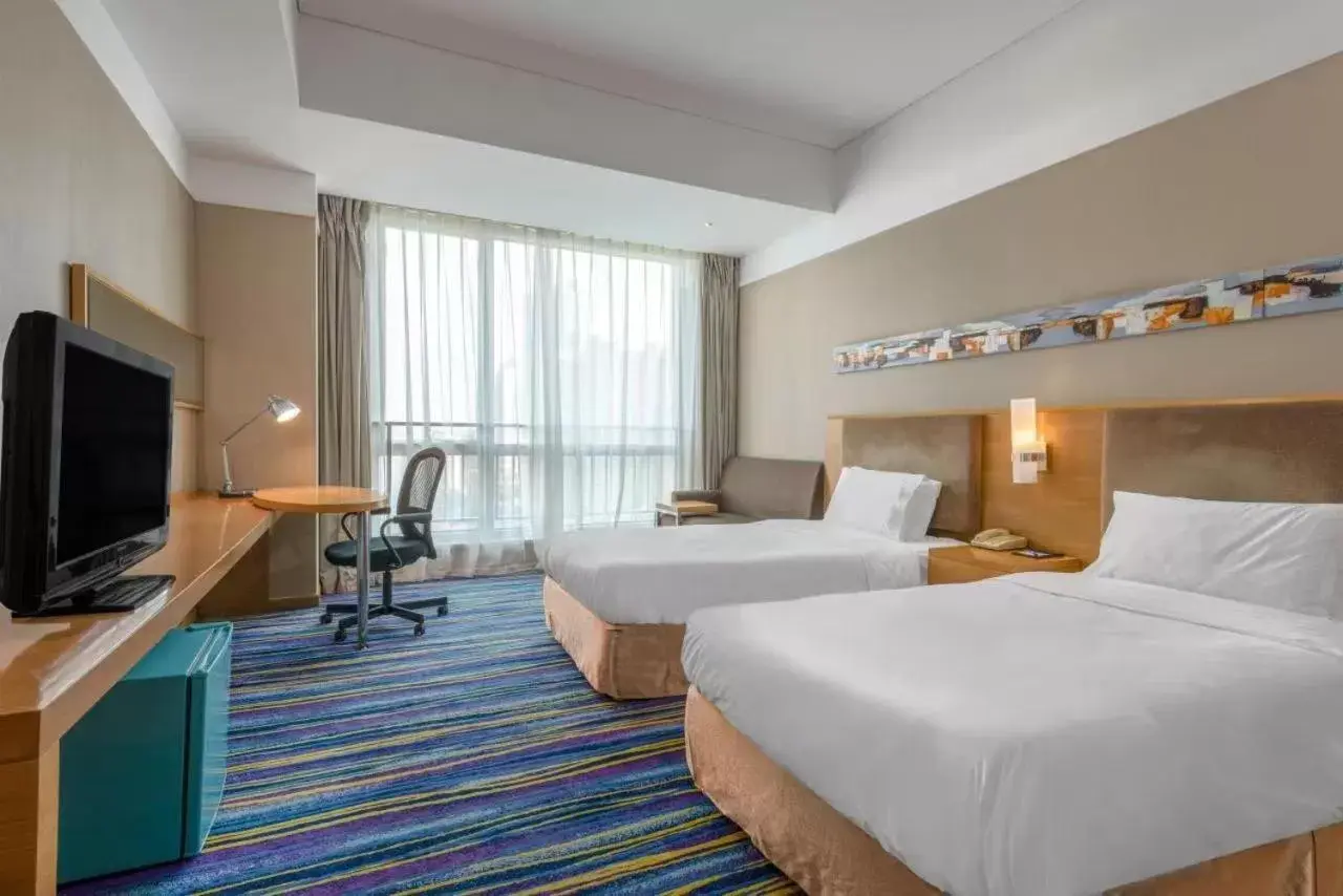 Bed in Holiday Inn Express Tianjin Heping, an IHG Hotel