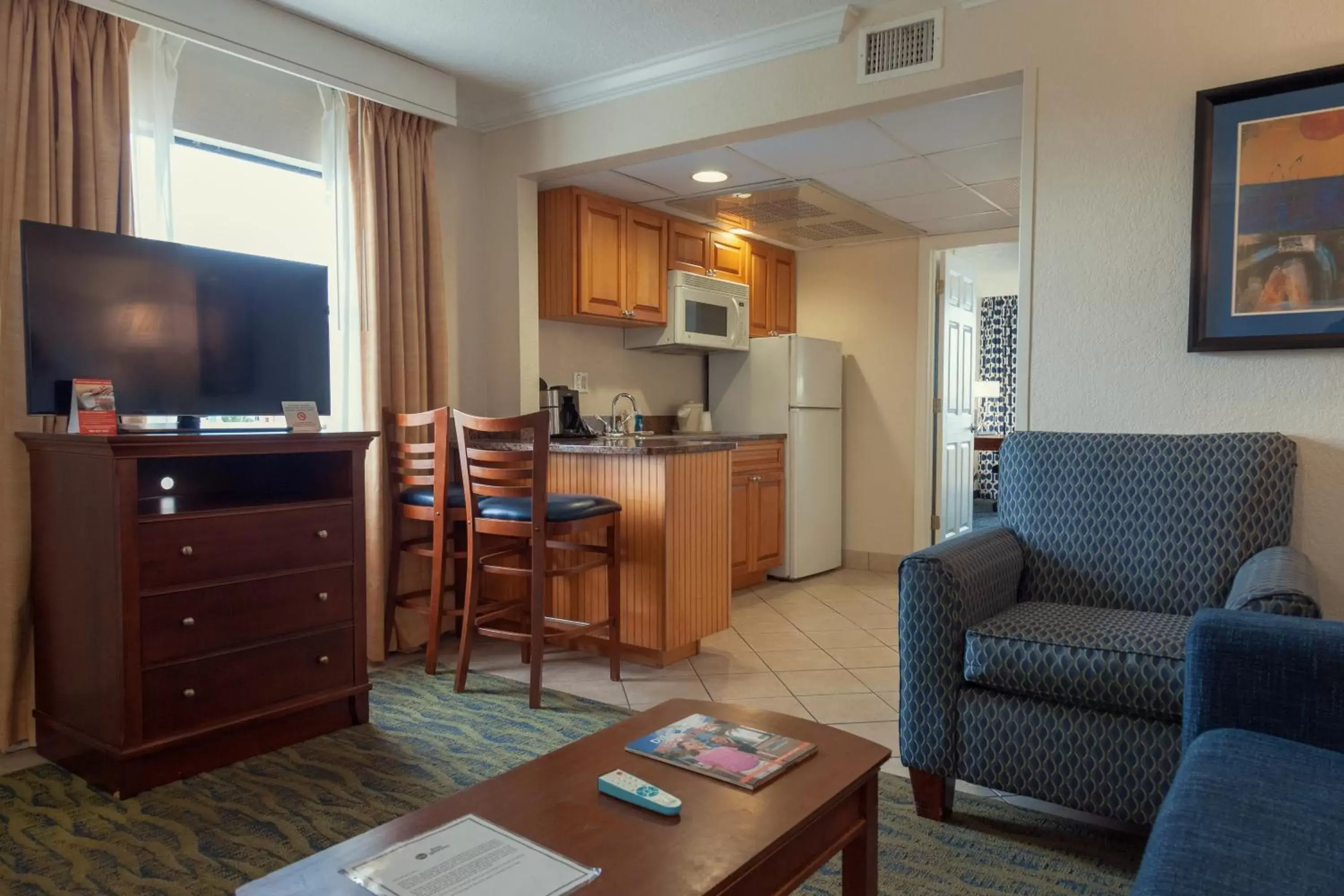 Communal lounge/ TV room, TV/Entertainment Center in Best Western Cocoa Beach Hotel & Suites