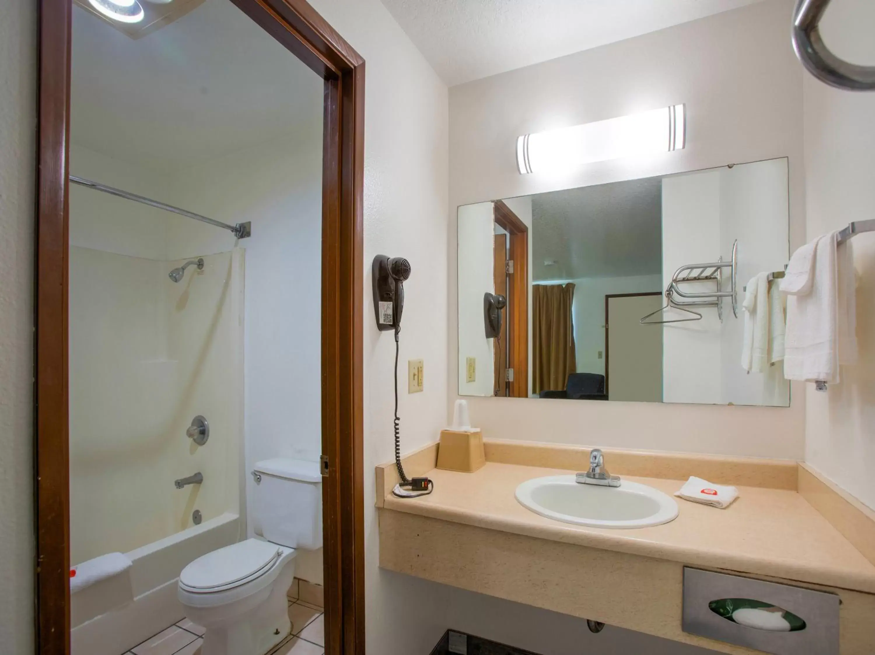 Bathroom in OYO Woodland Hotel and Suites