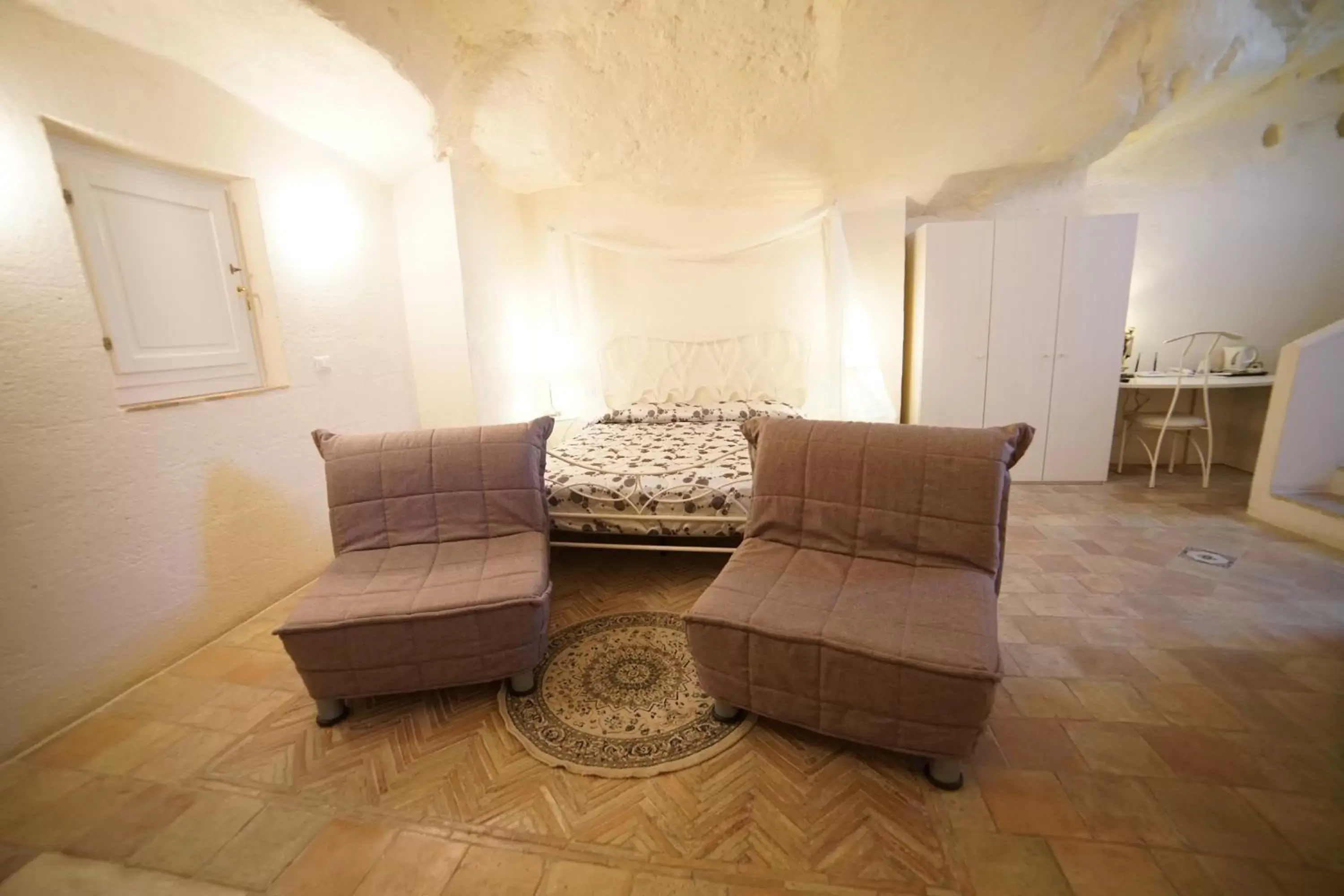 Bed, Seating Area in Il Belvedere