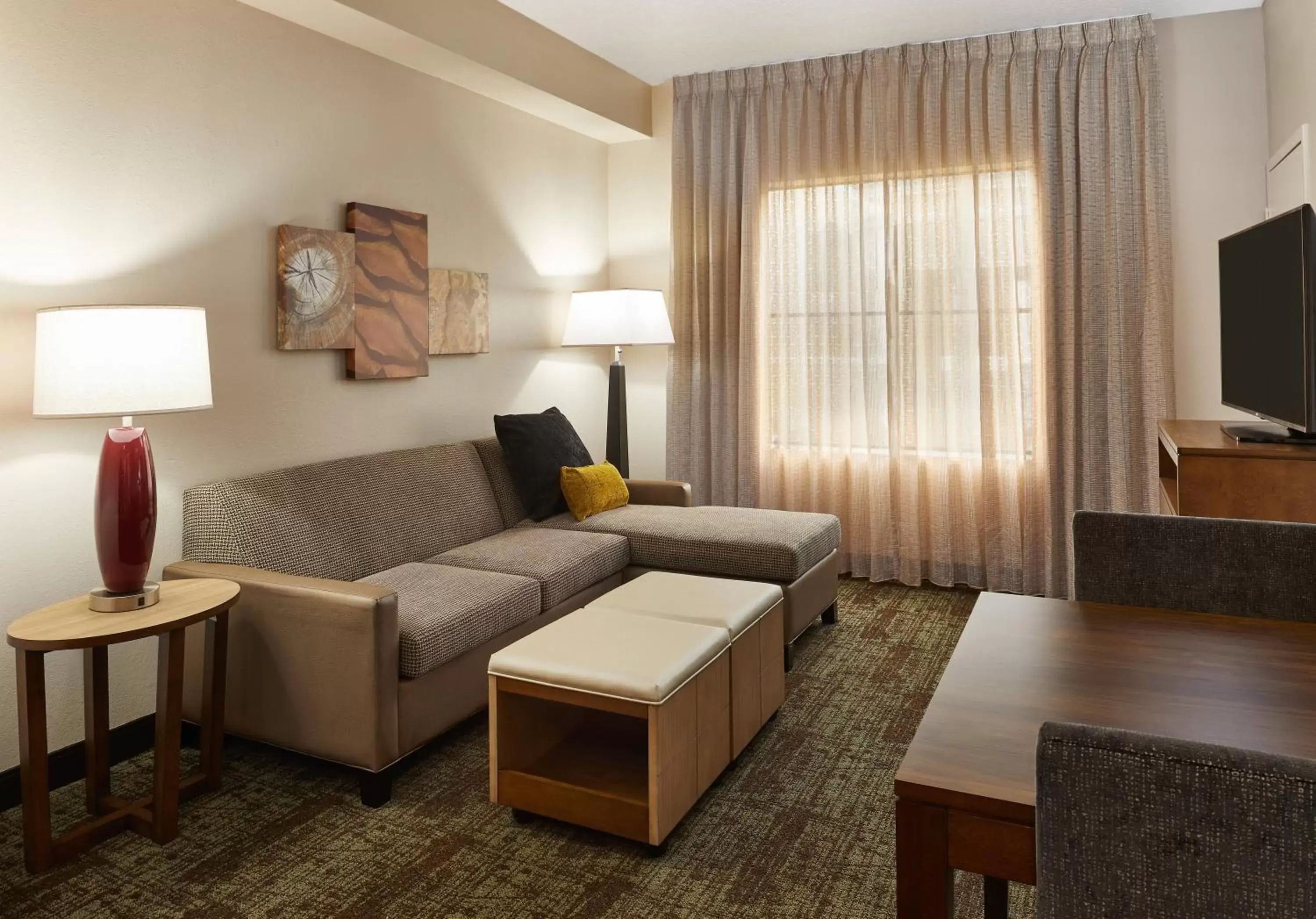 Bedroom, Seating Area in Staybridge Suites Orlando South, an IHG Hotel