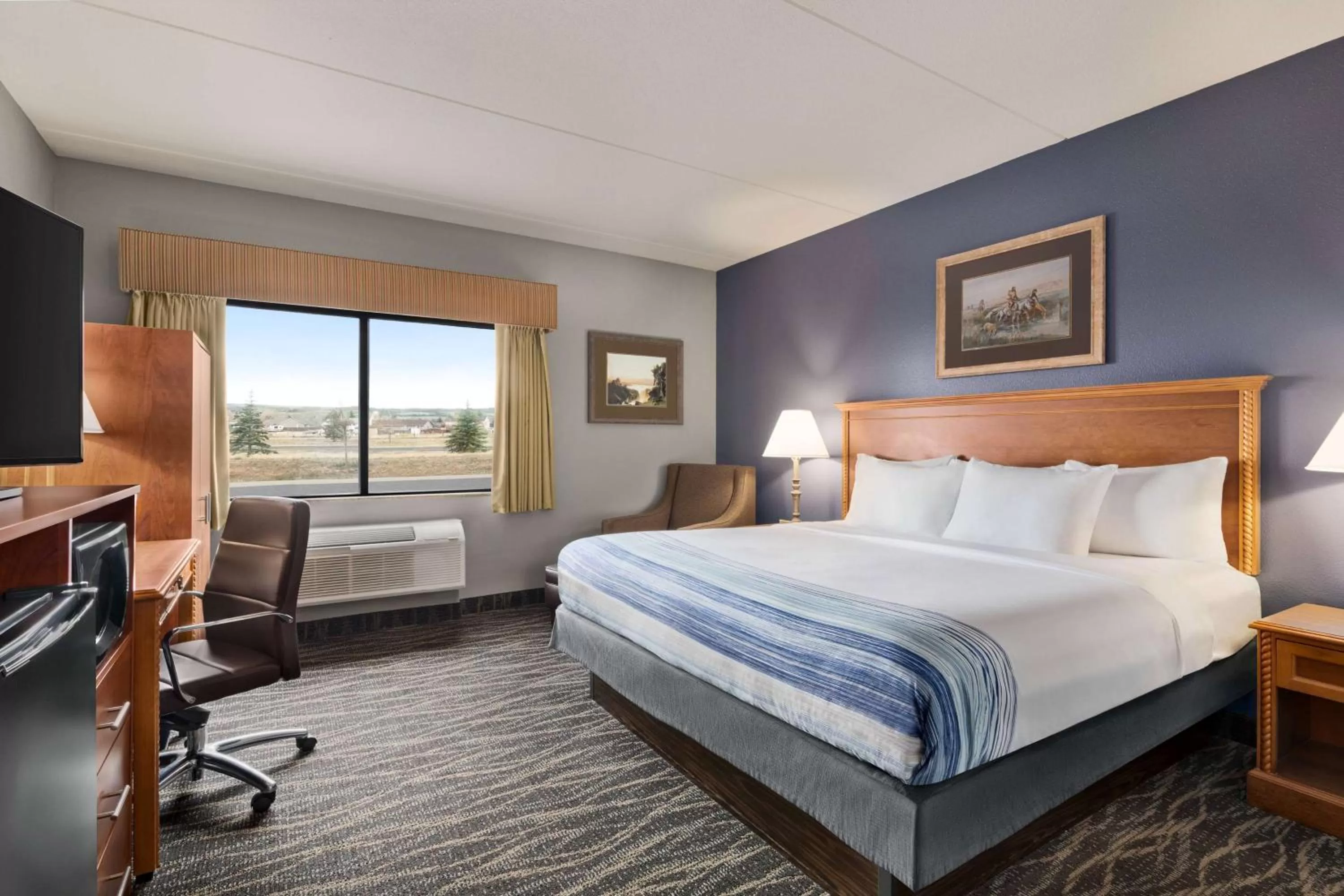 Photo of the whole room, Bed in AmericInn by Wyndham Laramie Near University of Wyoming