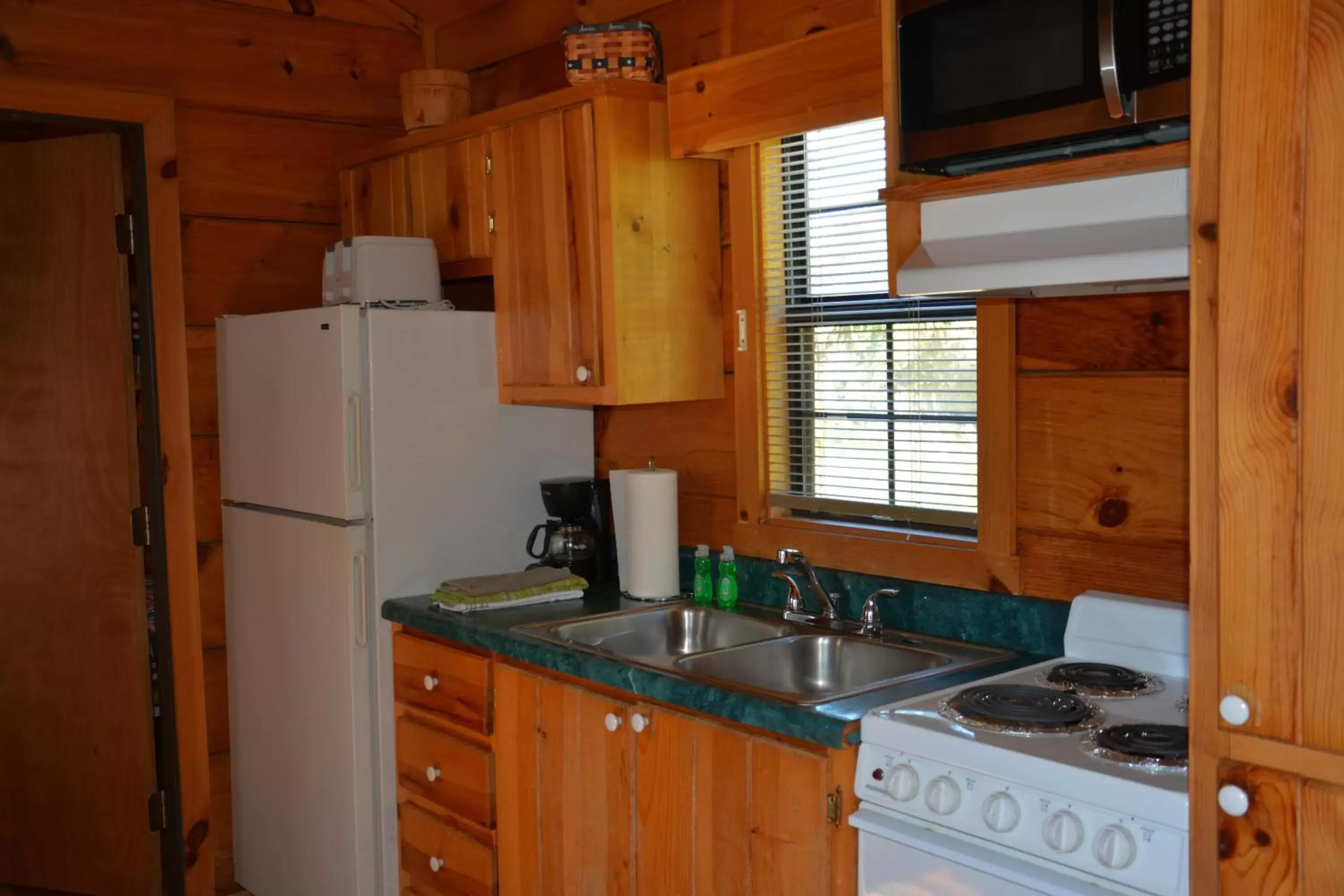 Kitchen/Kitchenette in Camp Mack, A Guy Harvey Lodge