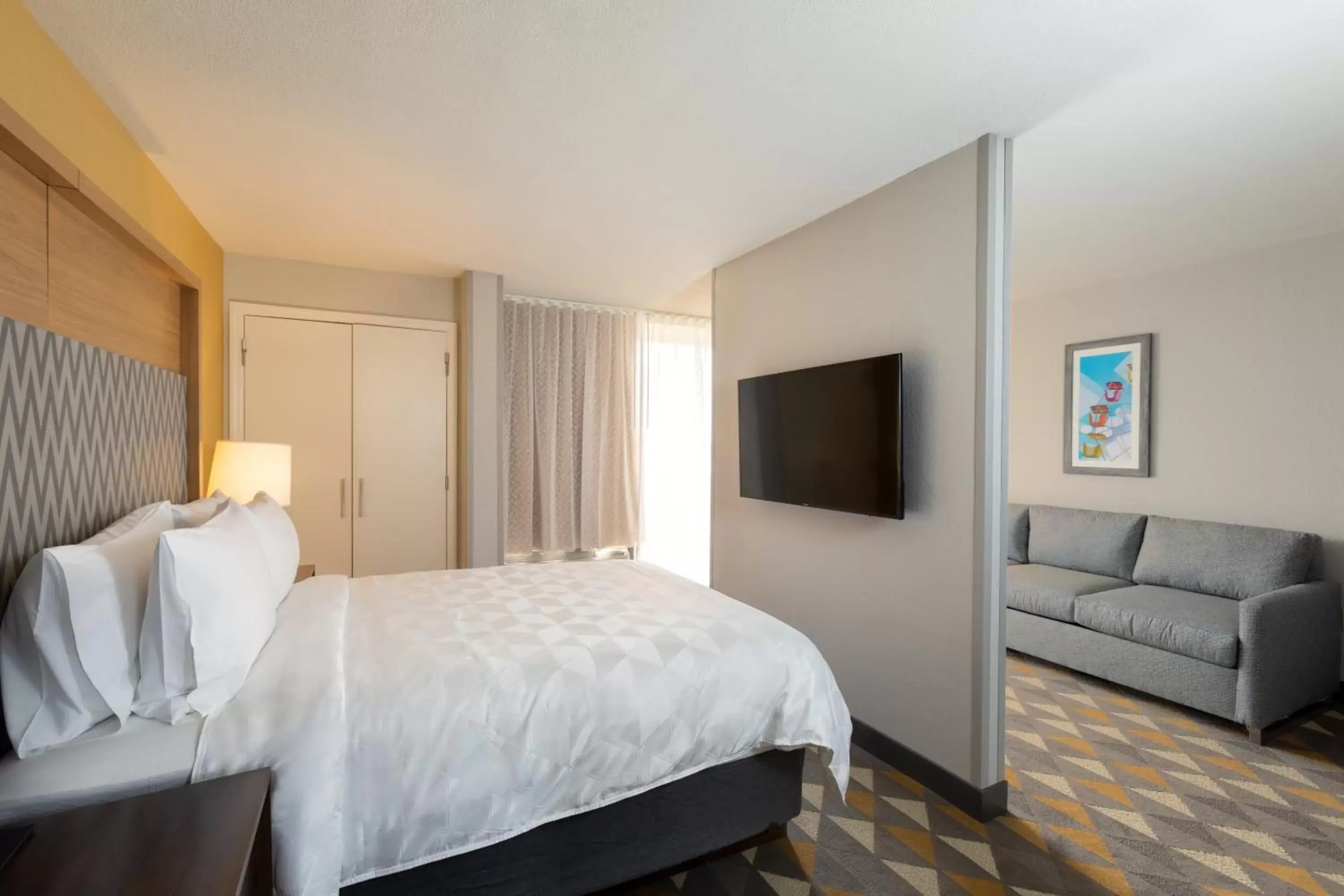 Photo of the whole room, Bed in Holiday Inn & Suites Orlando SW - Celebration Area, an IHG Hotel