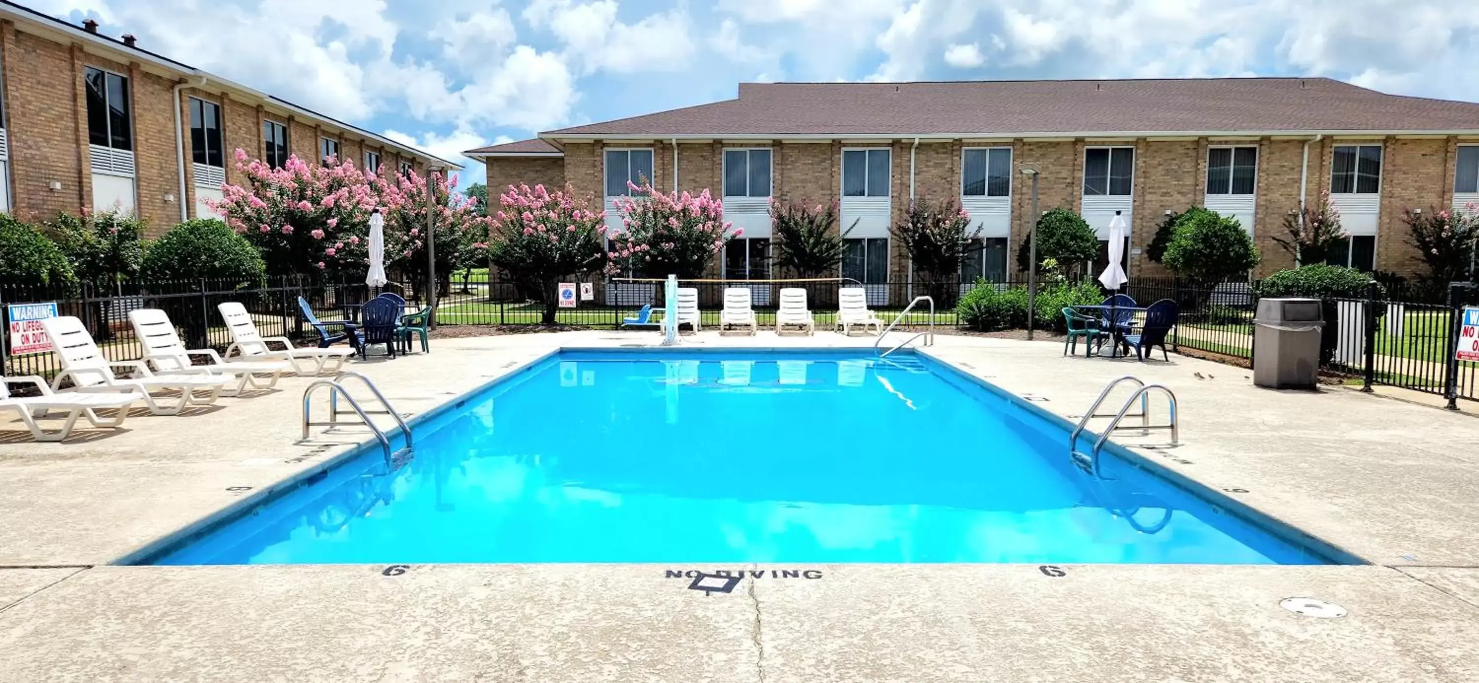 Swimming pool, Property Building in Americas Best Value Inn & Suites-Foley
