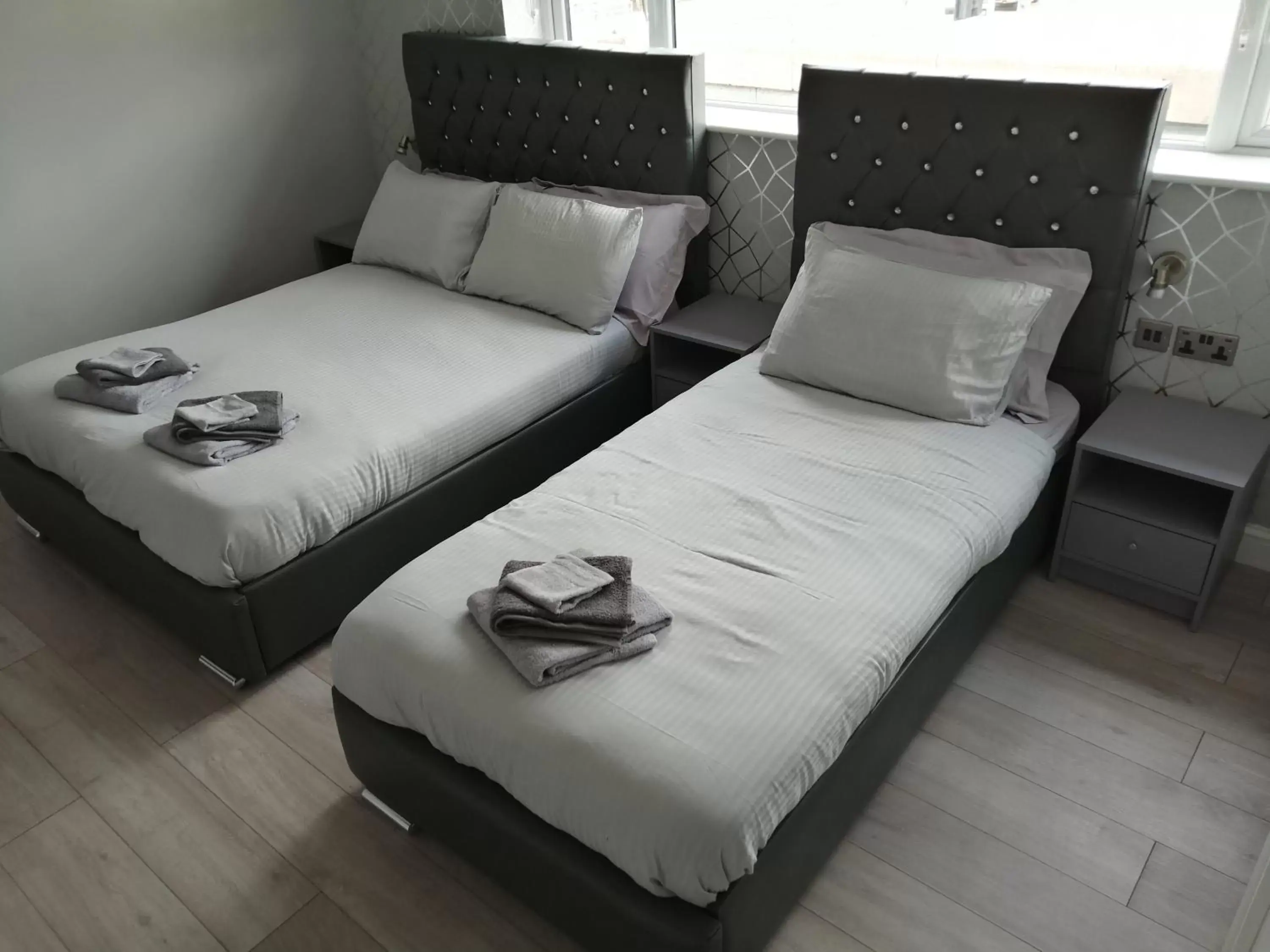 Bed in Encore Rooms